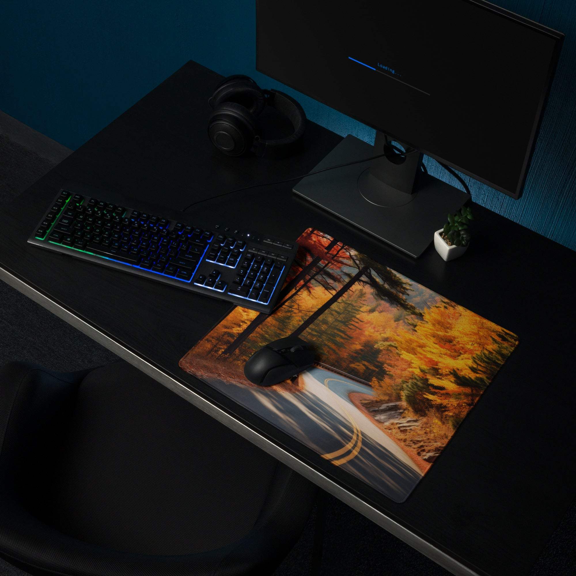 Vibrant autumn forest road gaming mouse pad with orange foliage and trees