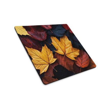 Vibrant autumn leaves glass cutting board in fall colors on dark background