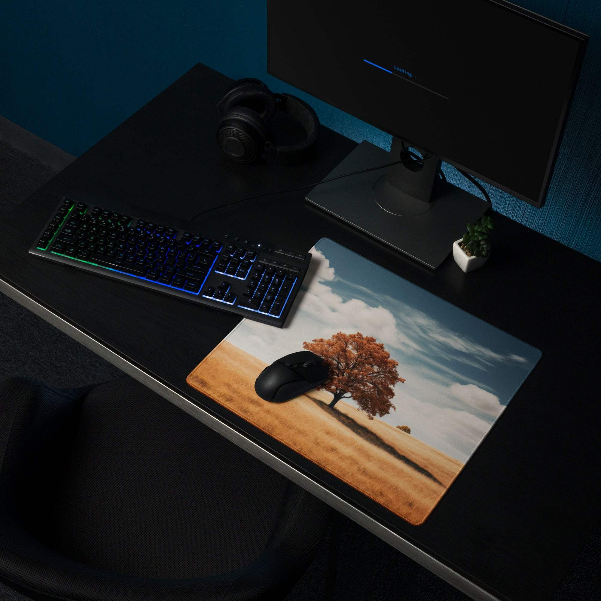 Calm autumn tree in golden field gaming mouse pad on dark desk