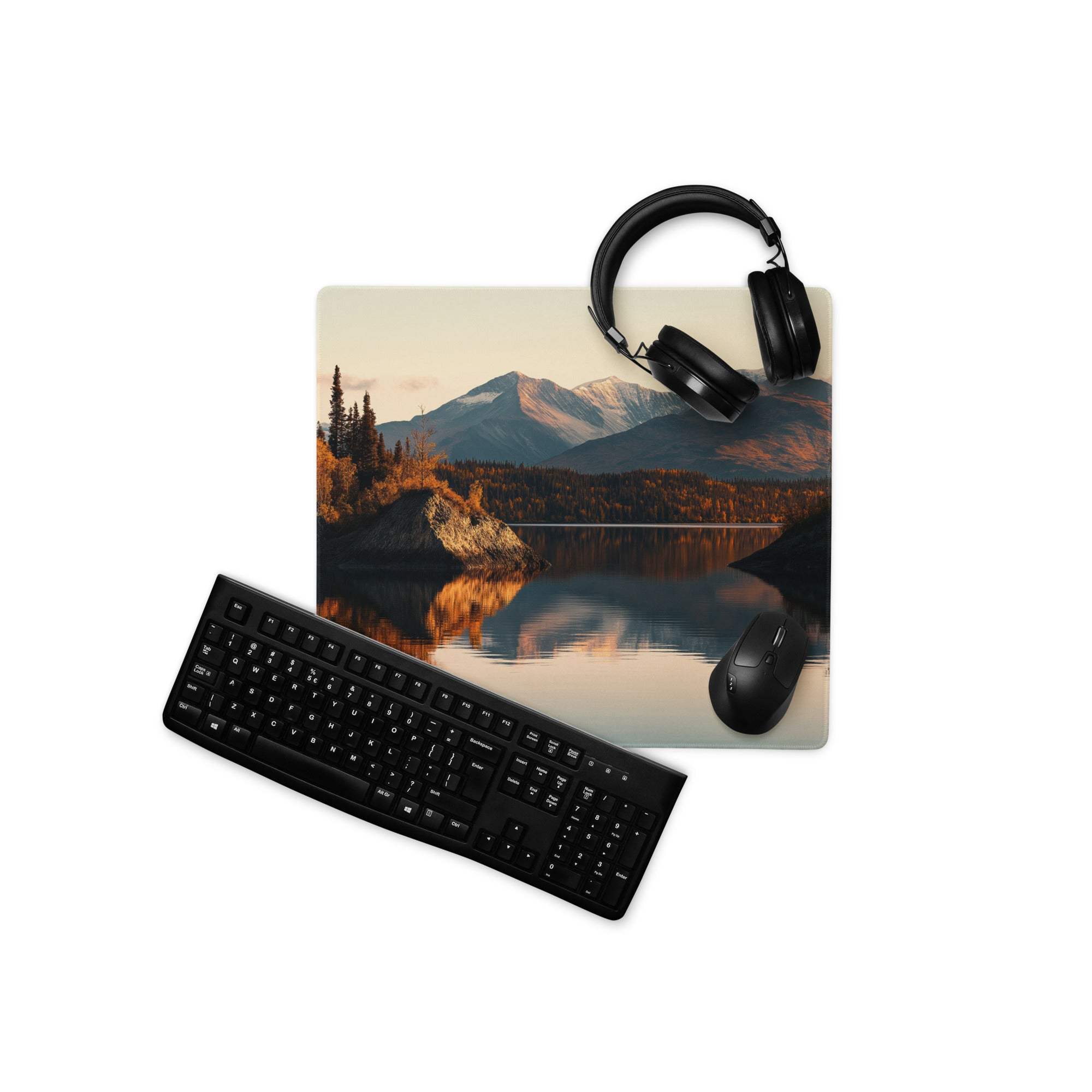 Black matte wireless QWERTY keyboard on white surface, diagonal view