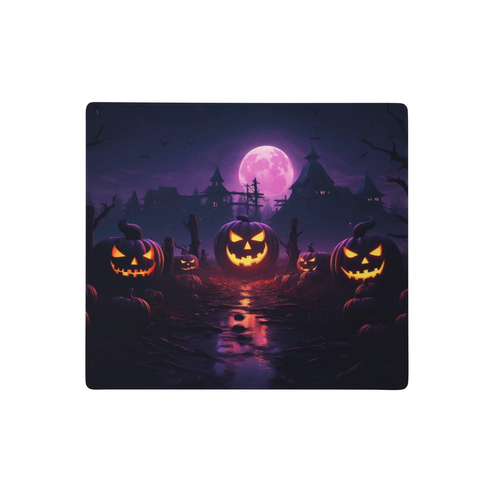 Halloween pumpkin purple gaming desk pad featuring glowing orange jack o lanterns and a purple moon over haunted houses