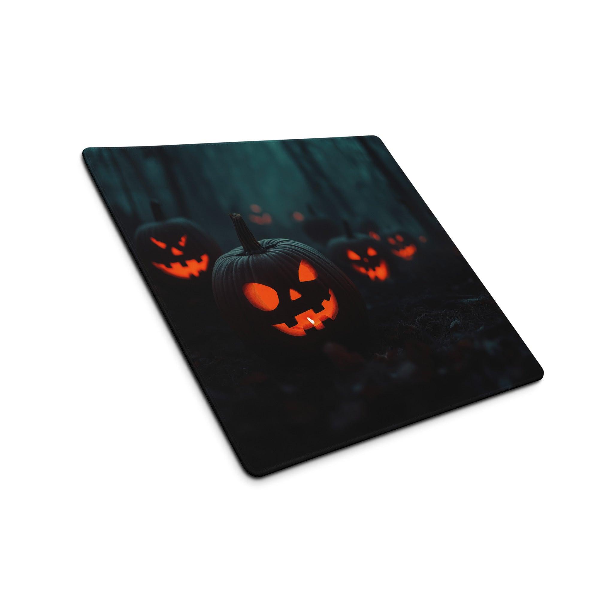 Black rectangular Halloween mousepad with glowing orange jack-o-lanterns in dark forest
