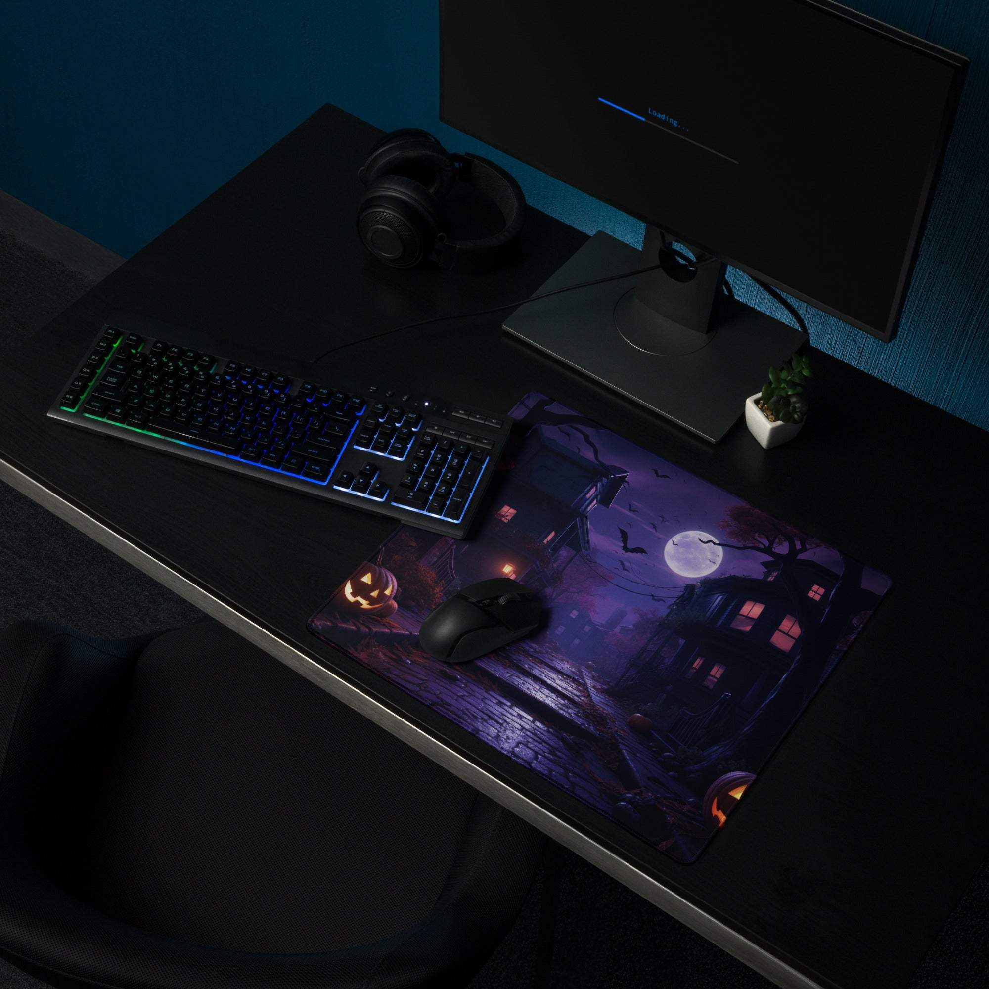 Halloween moonlit night gaming mouse pad with haunted house, jack o lanterns, purple orange glow, non-slip backing