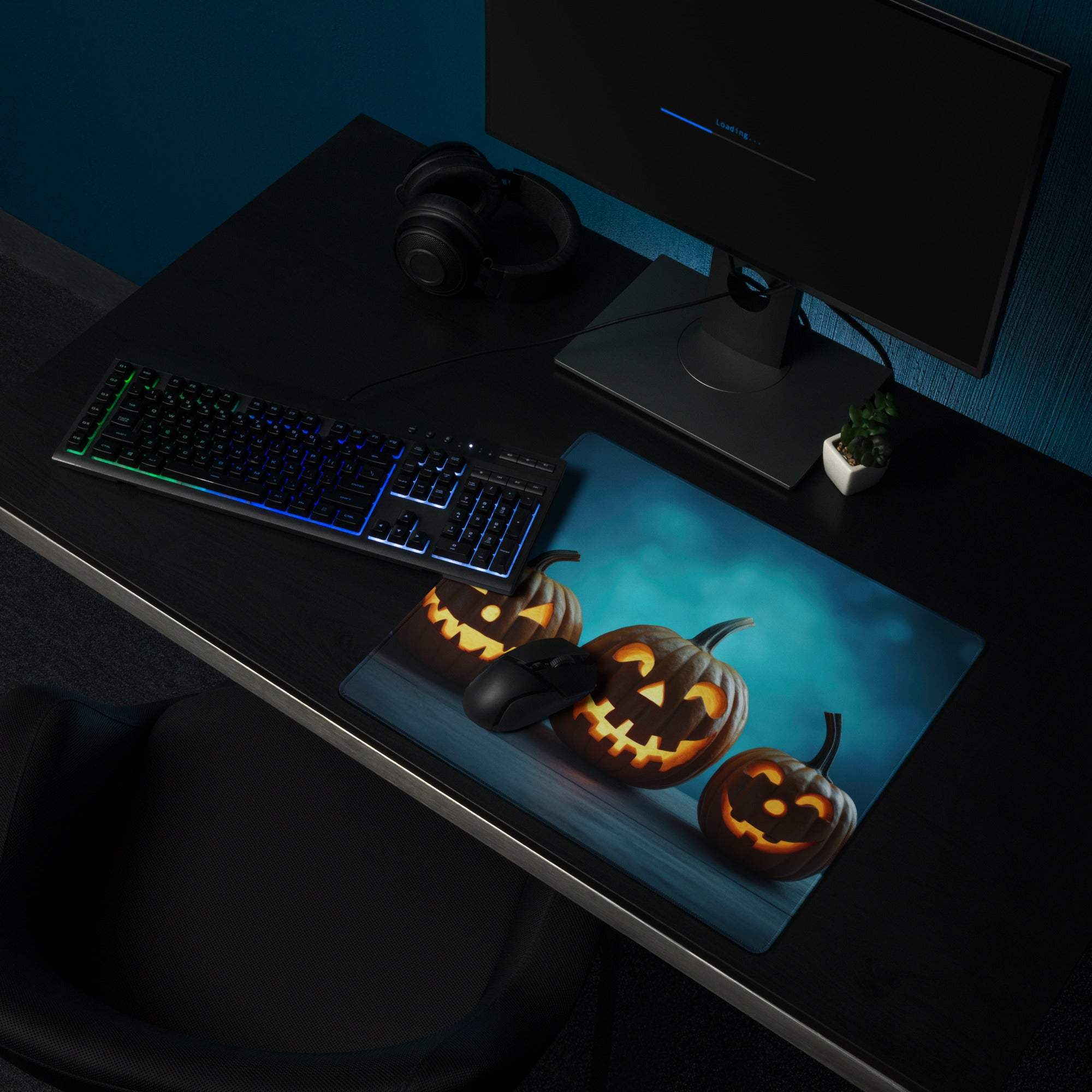 Halloween gaming mouse pad with glowing jack-o-lanterns on dark blue