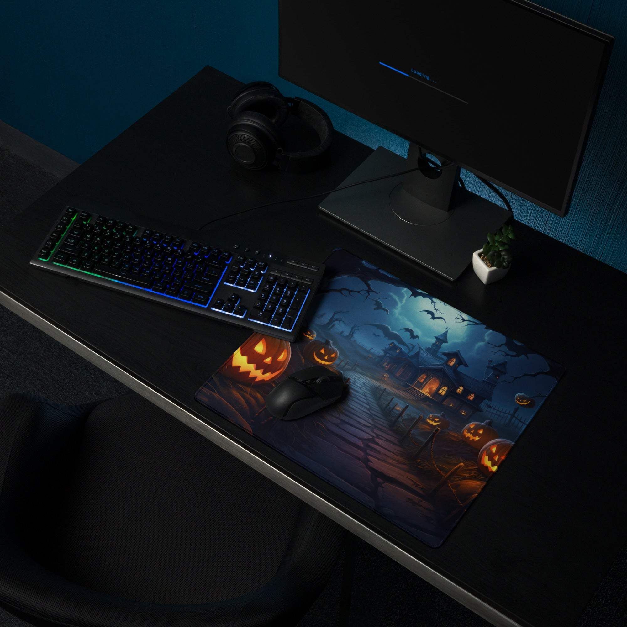 Spooky Halloween haunted house gaming mouse pad with glowing jack-o-lanterns