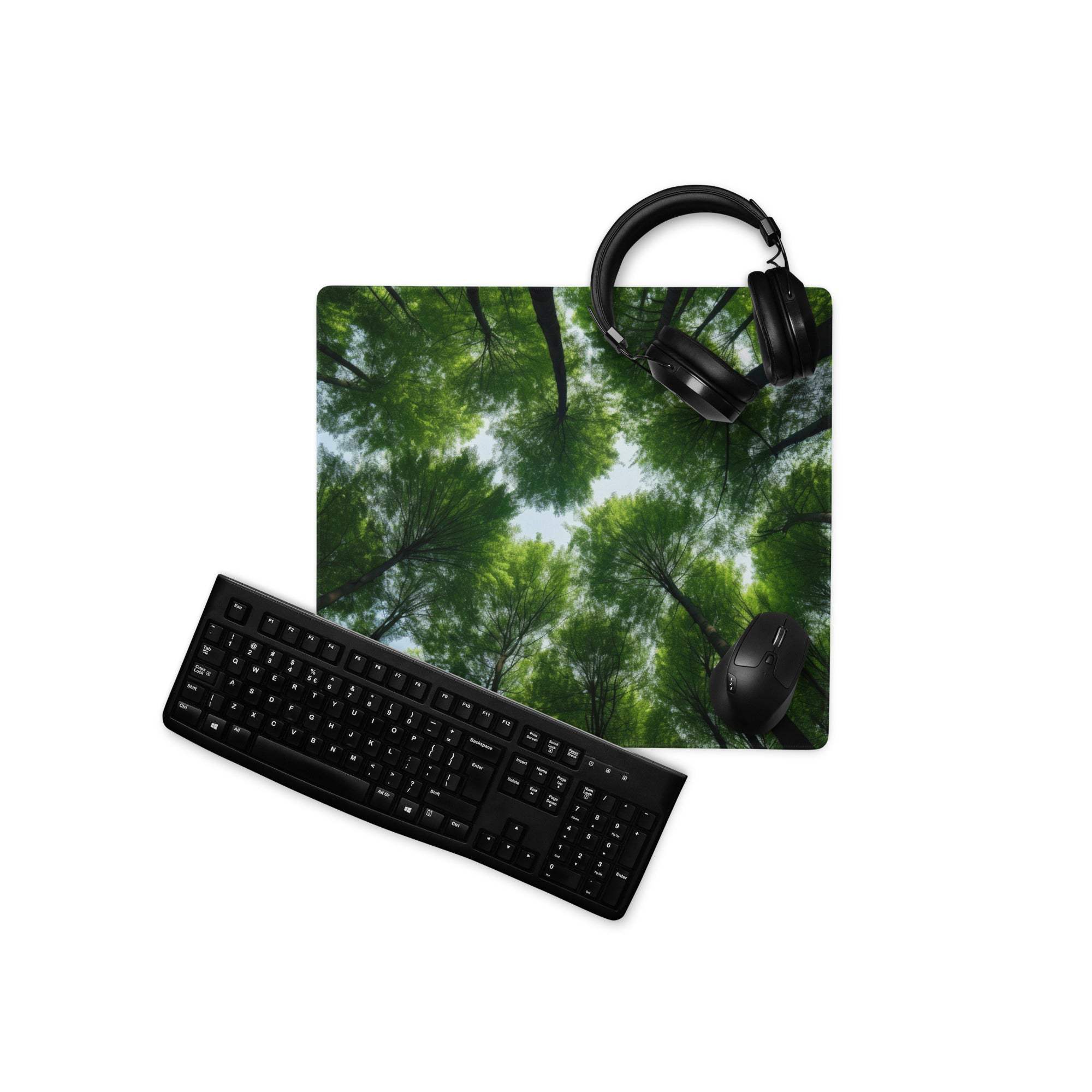 Black keyboard on large forest canopy gaming mouse pad