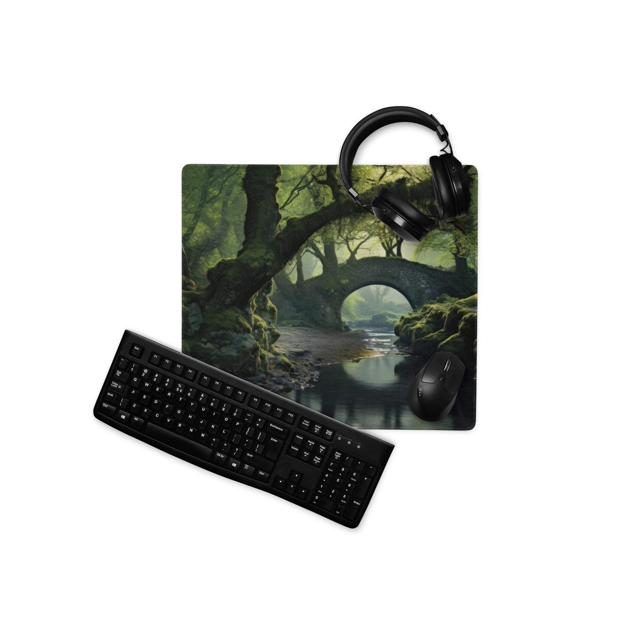 Black keyboard and mouse on moody emerald green forest bridge gaming mousepad