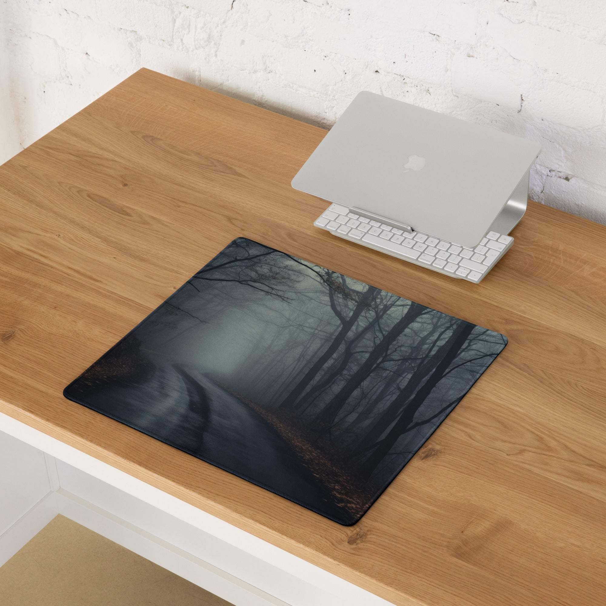 Dark forest gaming mousepad with misty design, non-slip base, stitched edges
