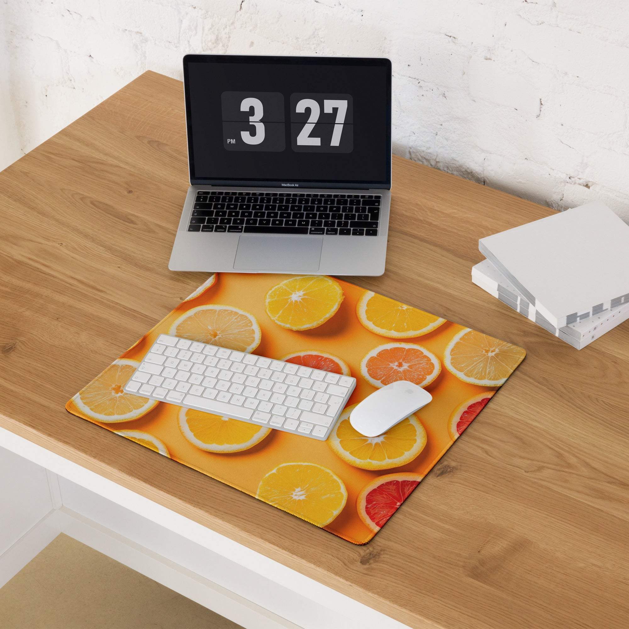 Vibrant orange citrus slice gaming mouse pad with white keyboard and mouse