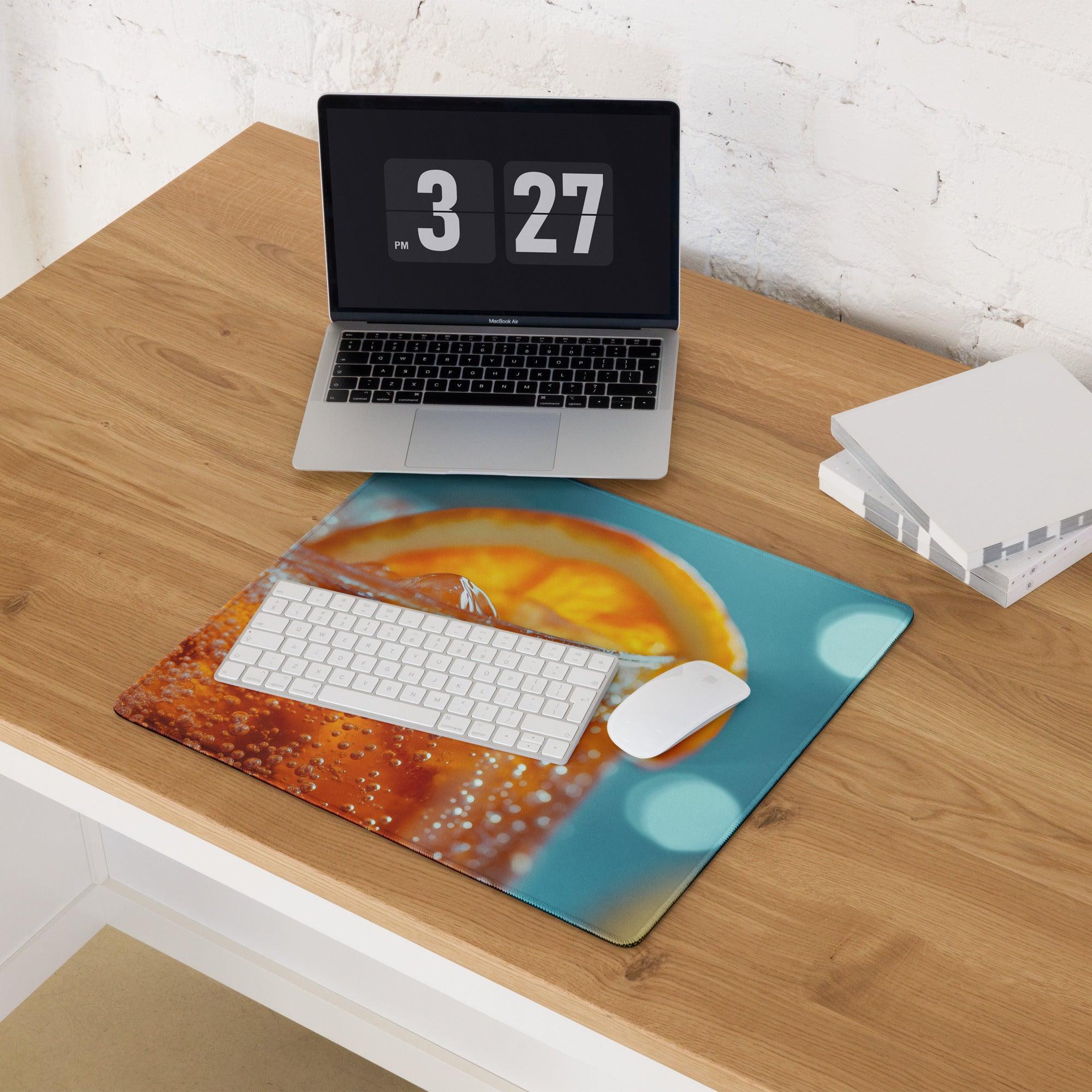 Vibrant orange soda-themed gaming mouse pad with glossy finish and non-slip base