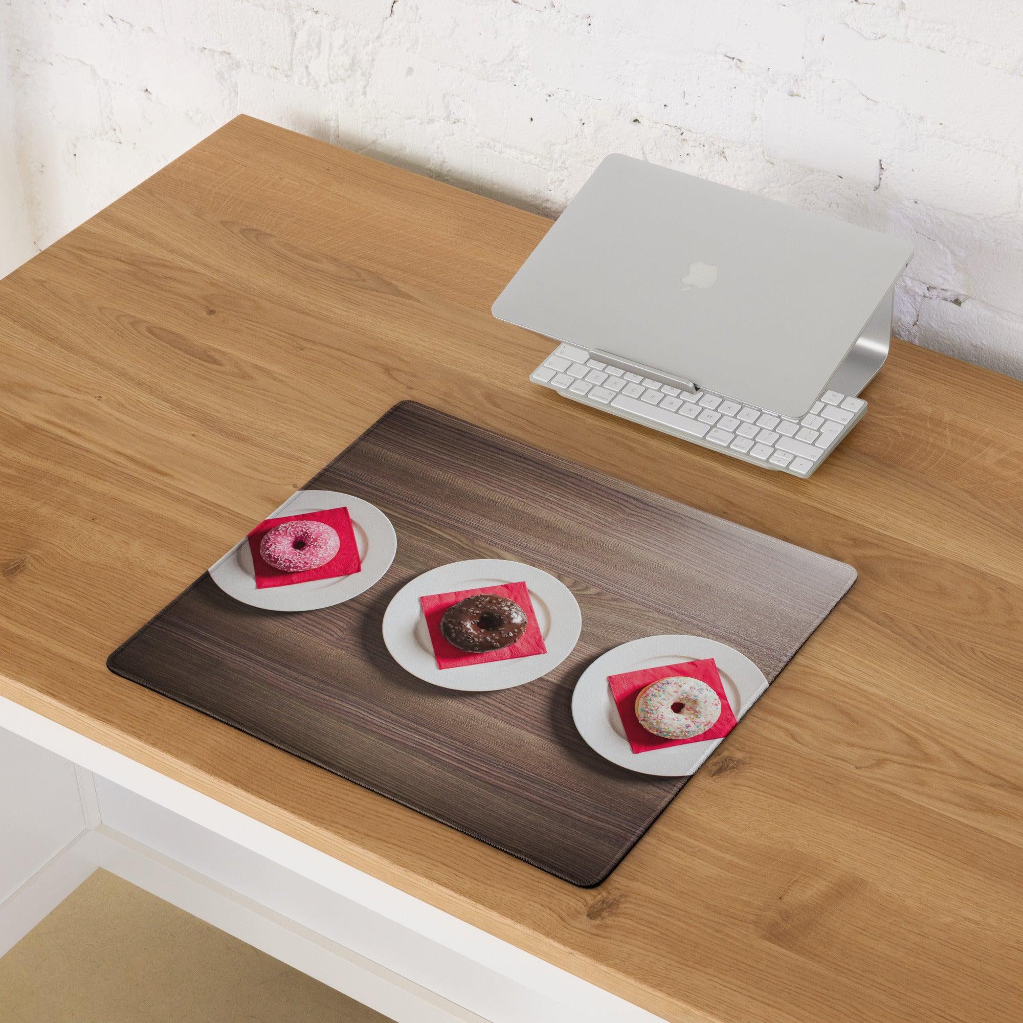 Dark wood-grain large gaming mousepad with three donuts on plates