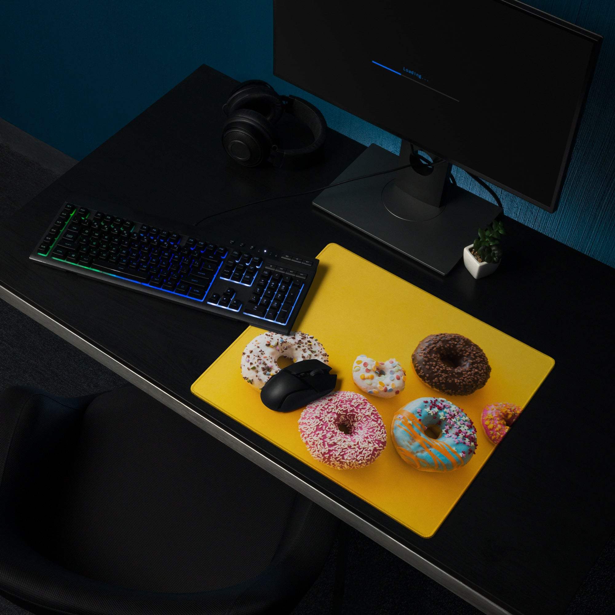 Vibrant large gaming mouse pad with colorful donuts, black mouse, non-slip base