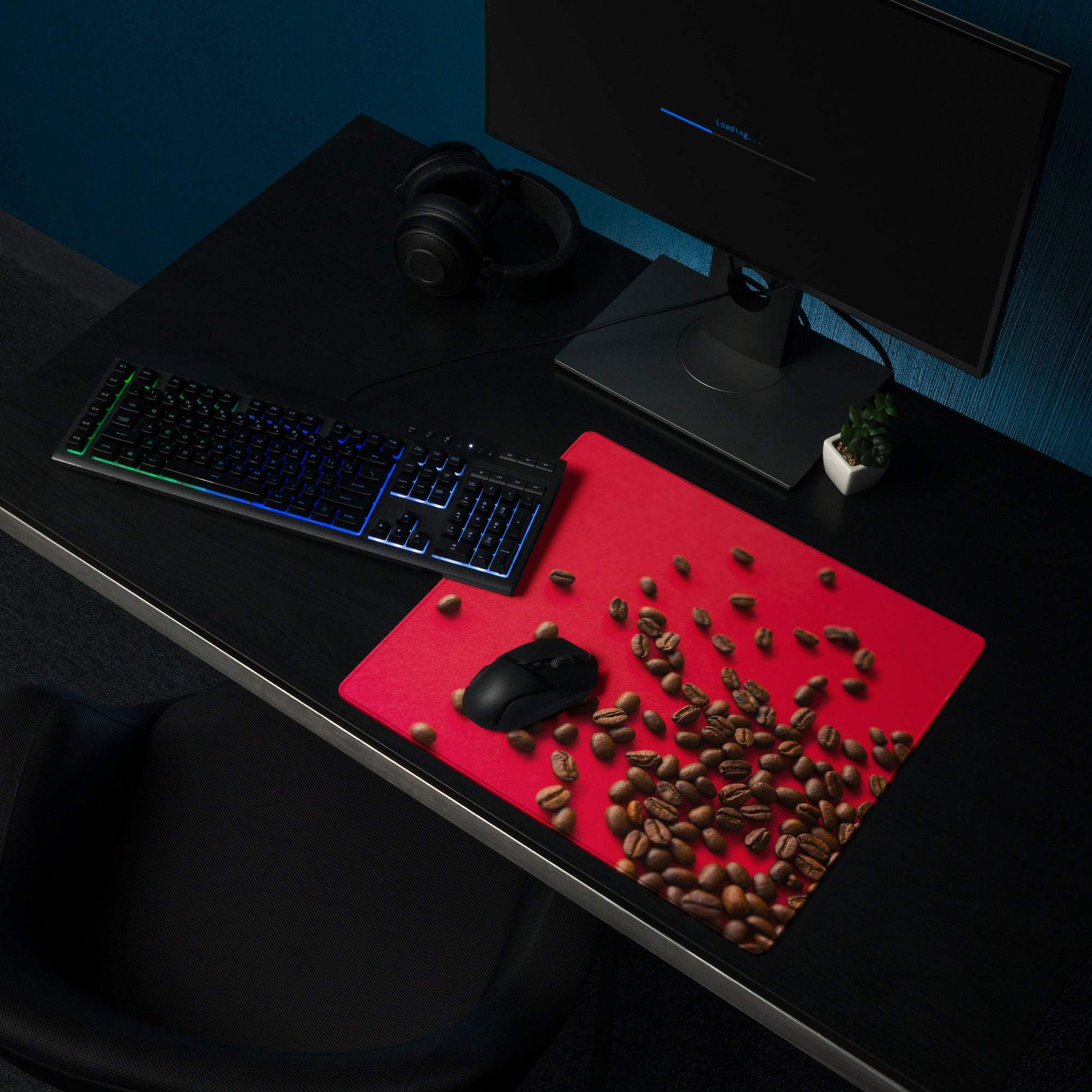 Bold red coffee bean themed gaming mouse pad with black mouse on large non-slip surface