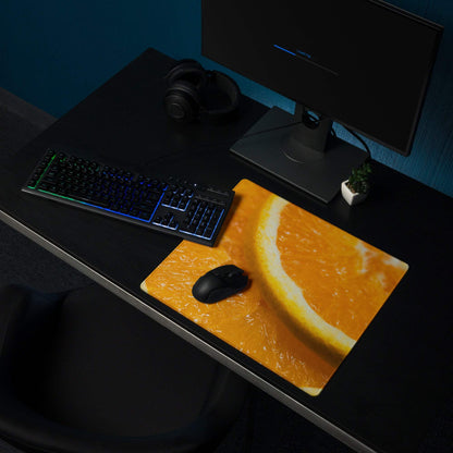 Vibrant orange slice gaming mouse pad with large surface and non-slip base