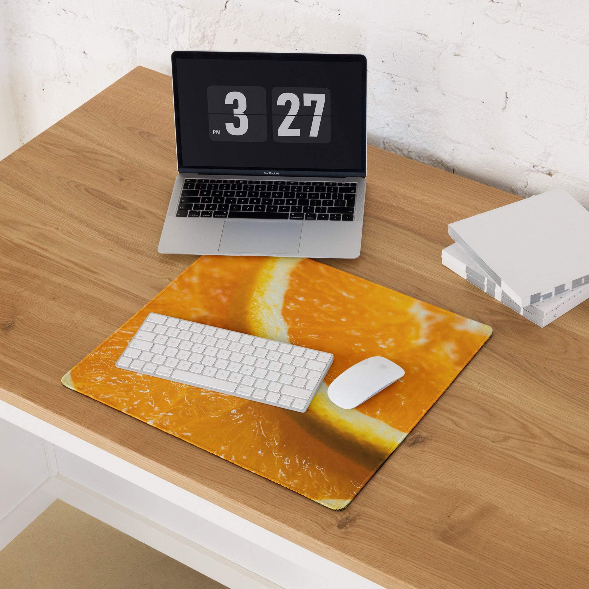 Vibrant orange slice gaming mouse pad with textured design and non-slip base
