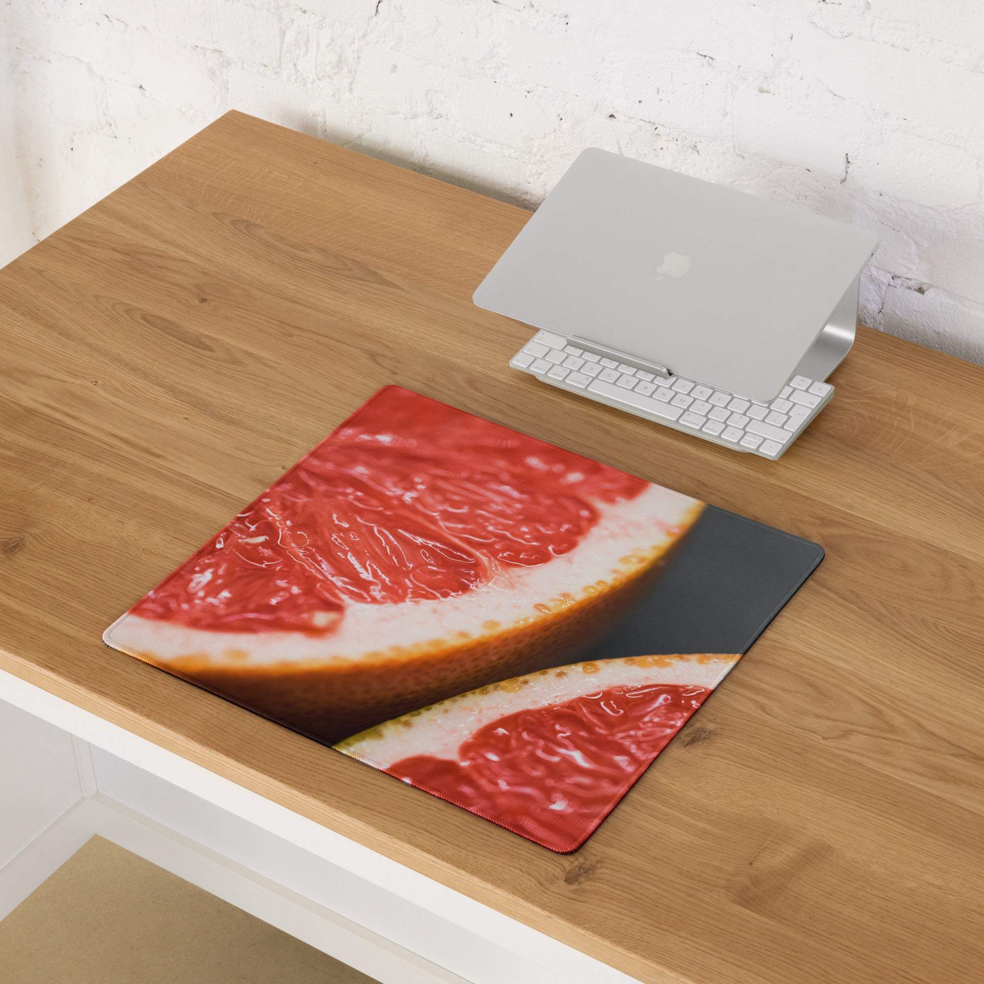 Vibrant grapefruit slice gaming mouse pad with non-slip edge stitching