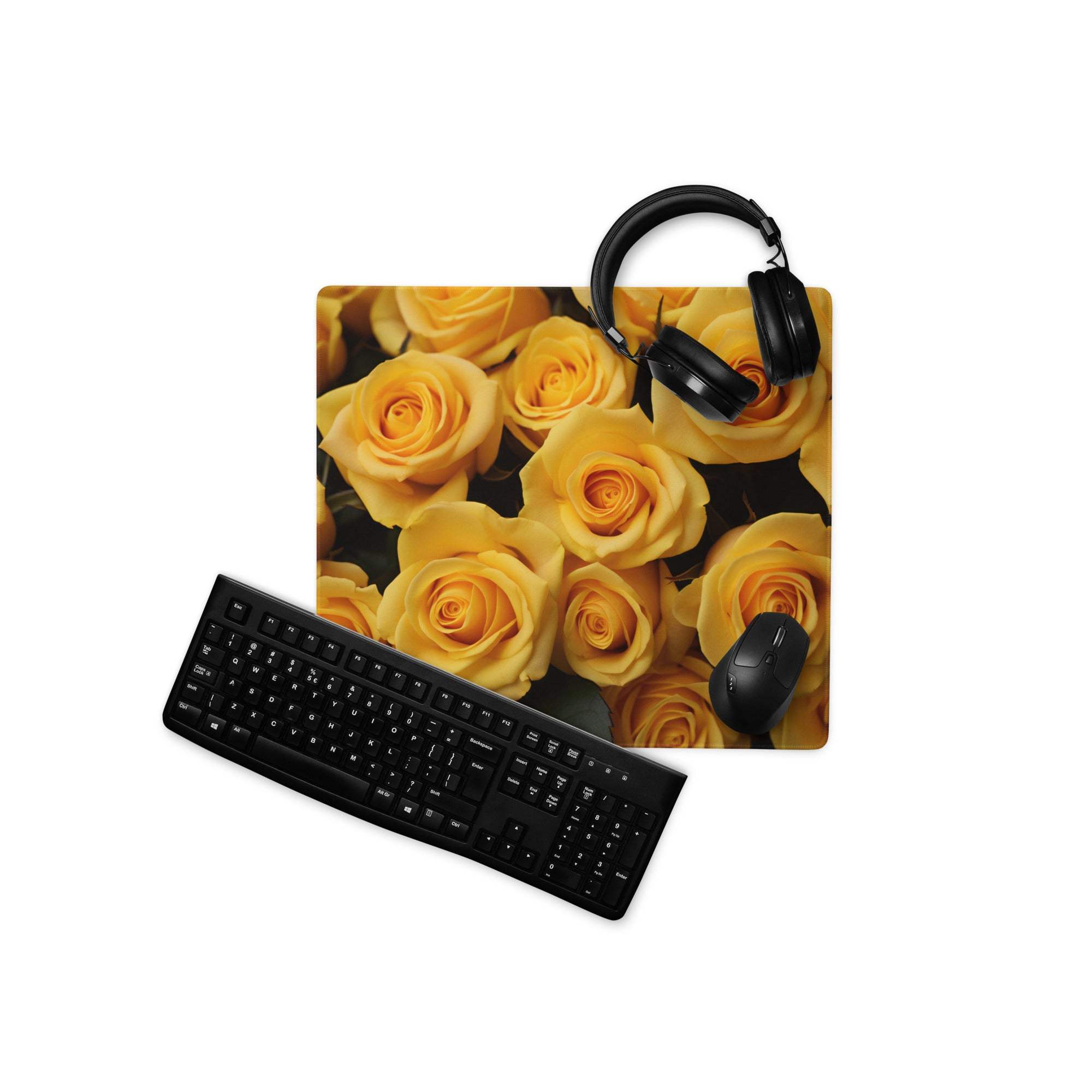 Large yellow rose gaming mouse pad with black headphones and keyboard