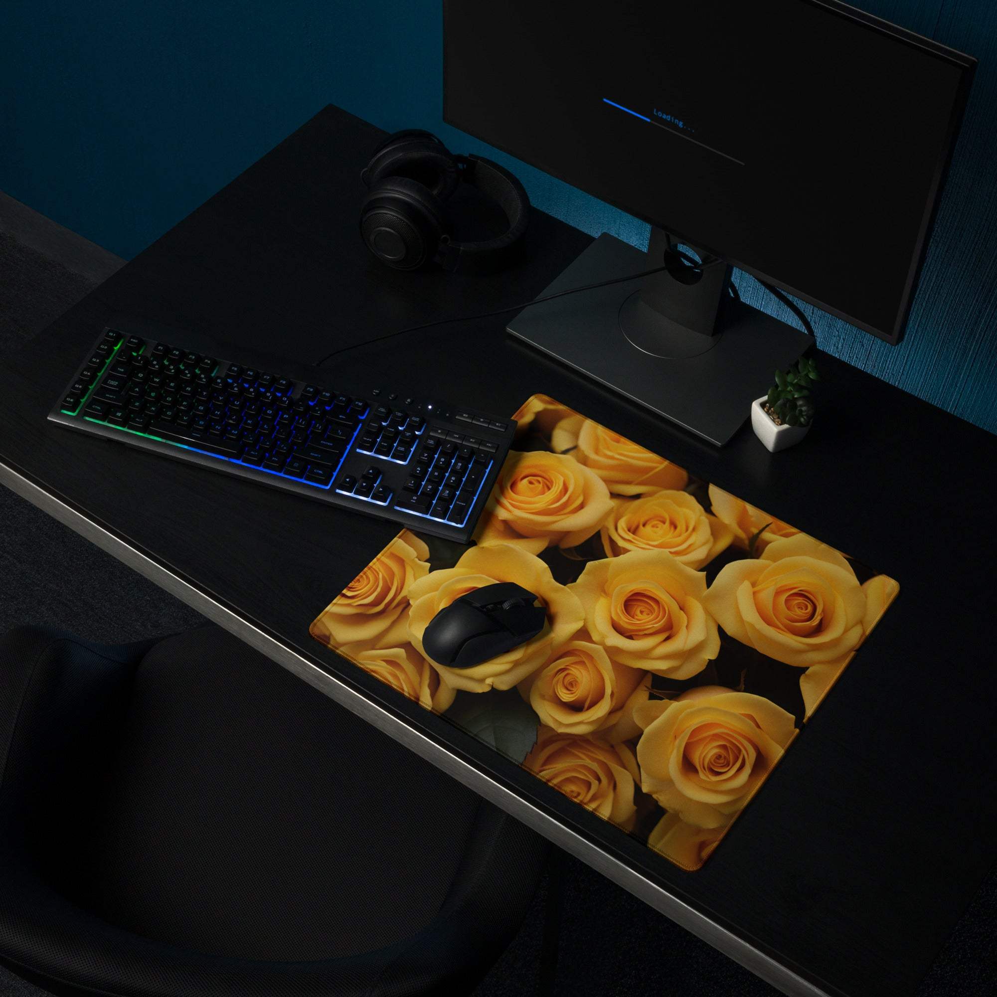 Large yellow rose gaming mouse pad with non-slip base on dark desk