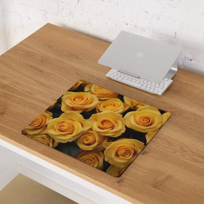 Large yellow rose gaming mouse pad with non-slip base on wooden desk