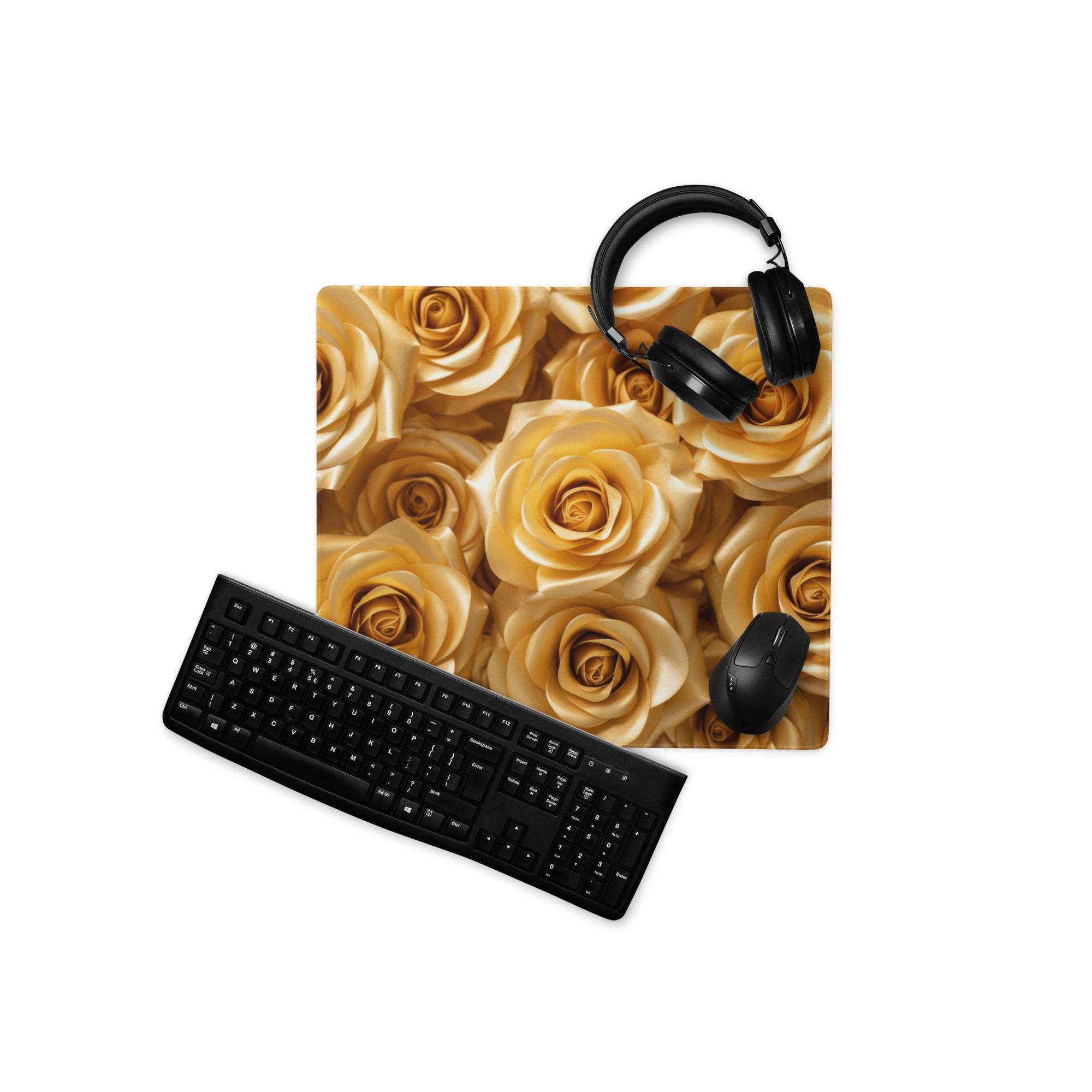 Gold rose-patterned gaming mousepad with black headphones and keyboard