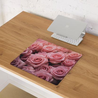 Pink rose gaming mousepad with non-slip base on wooden desk