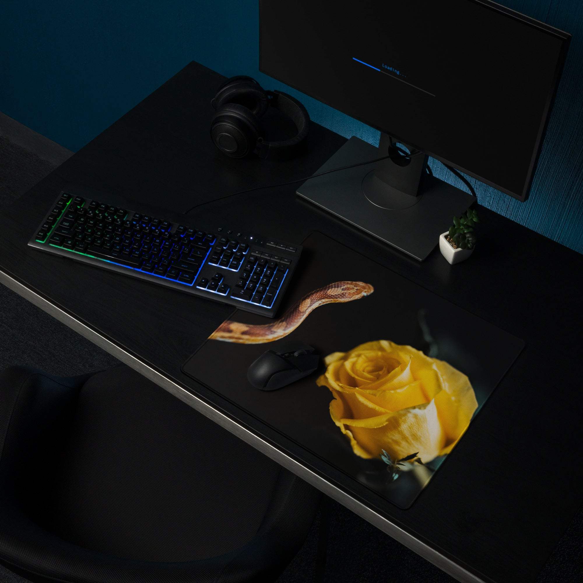Black gaming mouse pad with yellow rose and snake design