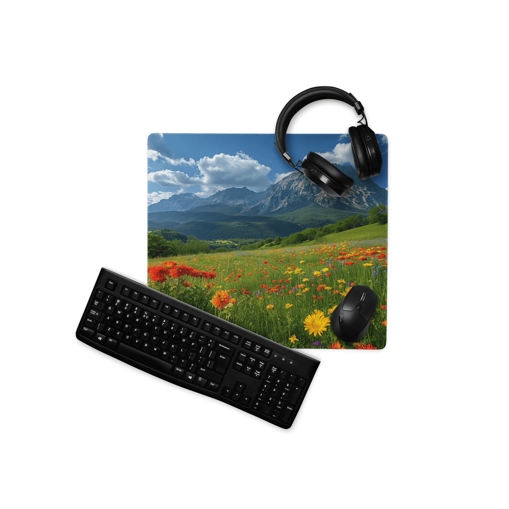 Black wireless keyboard mouse set on vibrant mountain meadow mousepad