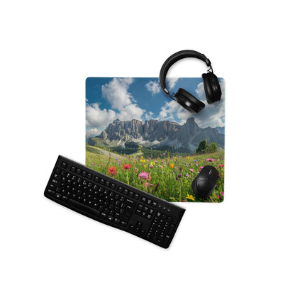 Black wireless QWERTY keyboard on Epic Majestic gaming desk mat