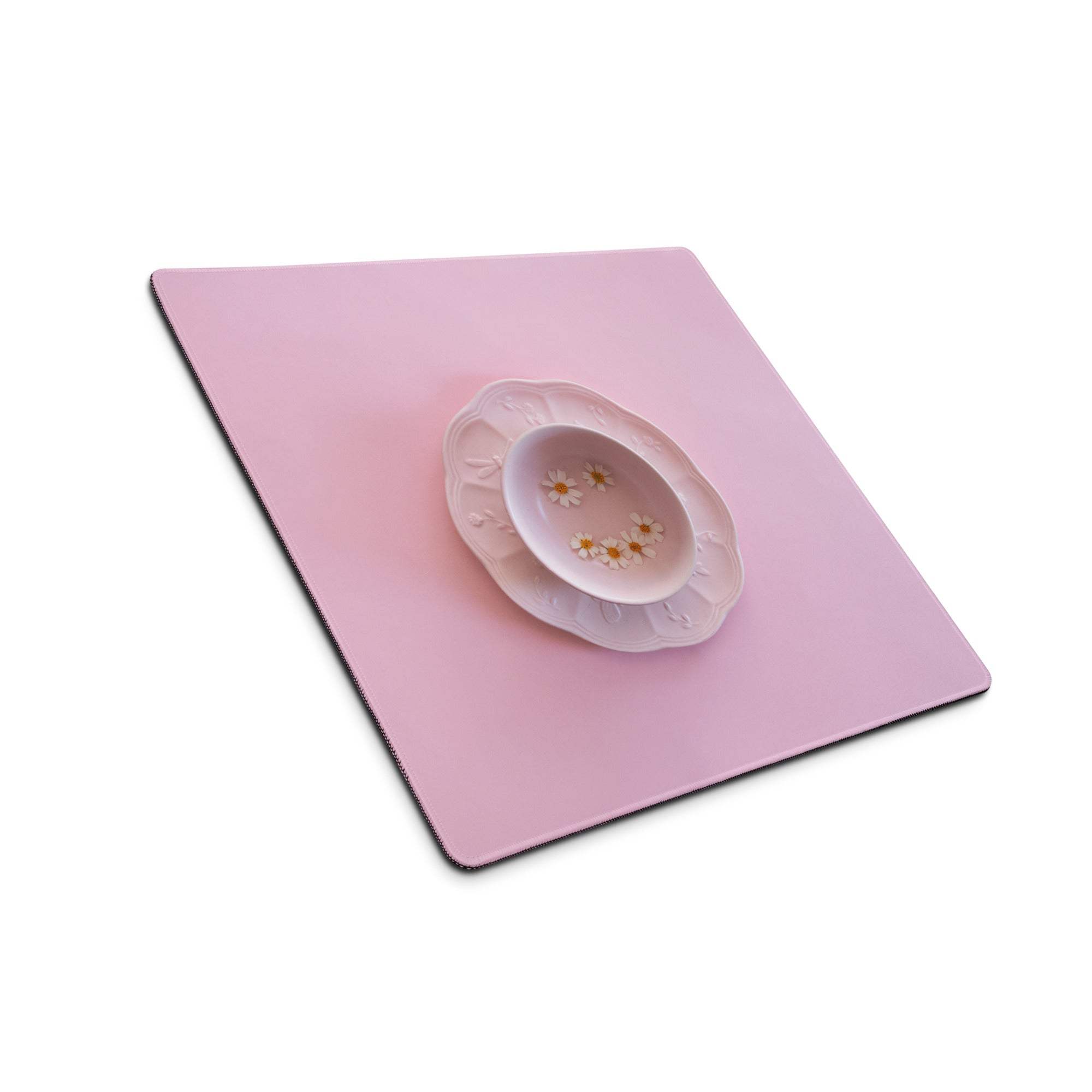 Delicate pink ceramic bowl with scalloped rim, daisies, non-slip backing view