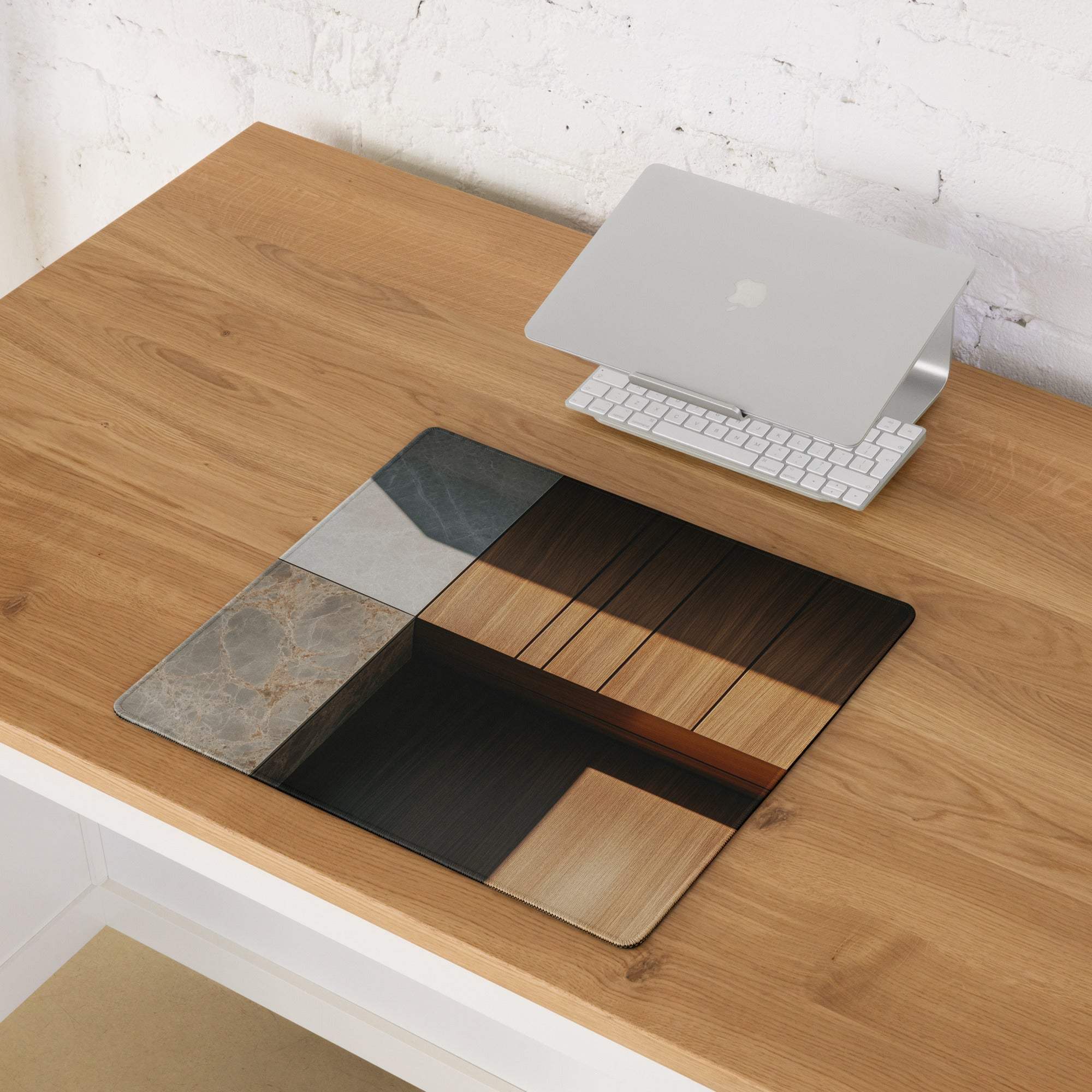 Sleek black marble wood silver laptop stand on modern gaming mouse pad