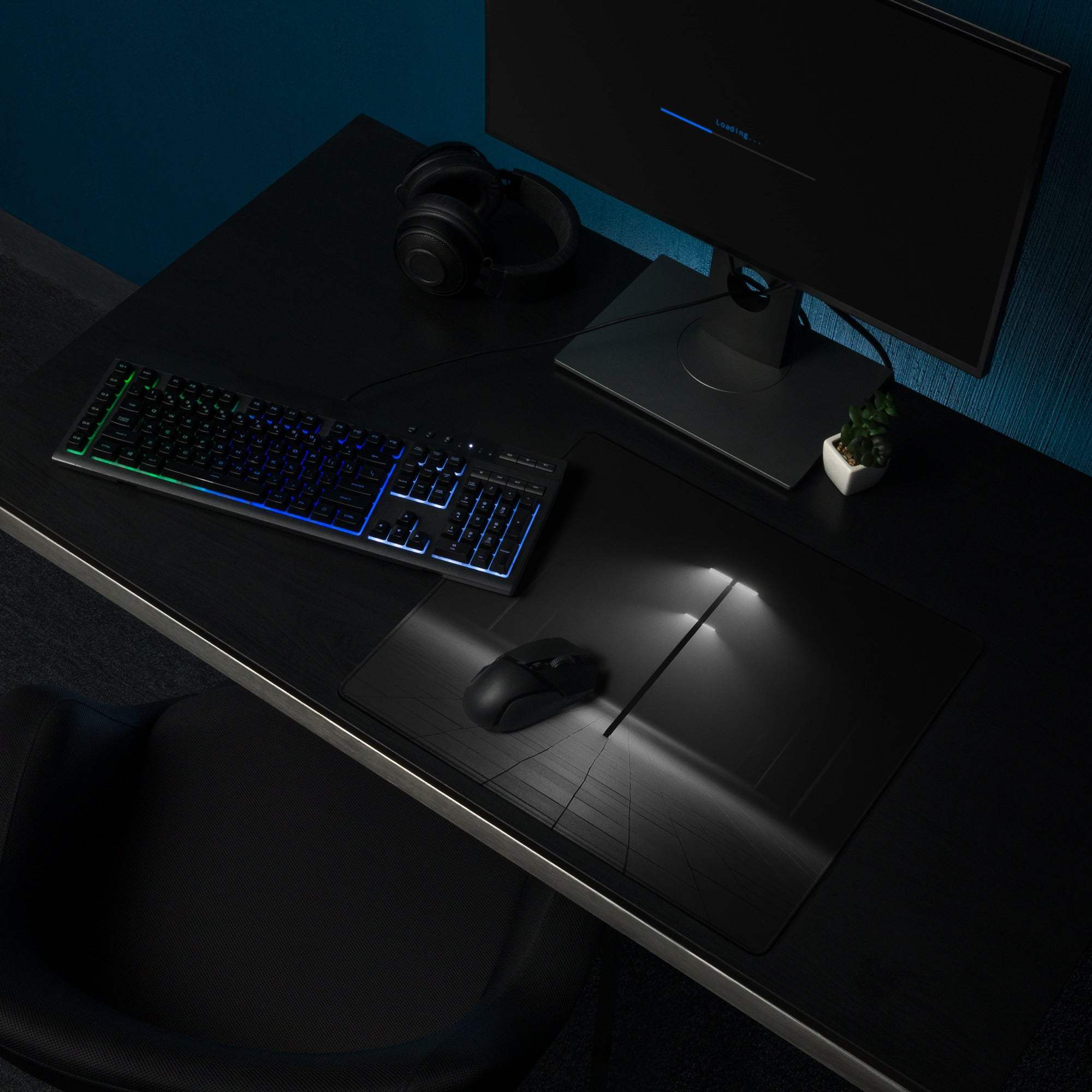 Black gaming mousepad with minimalist geometric lines, non-slip base, stitched edges