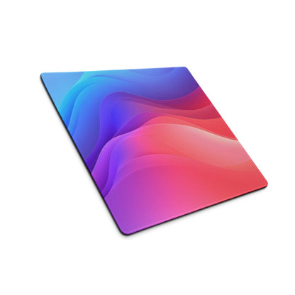 Vibrant gradient large gaming mouse pad with blue-to-magenta waves, non-slip base