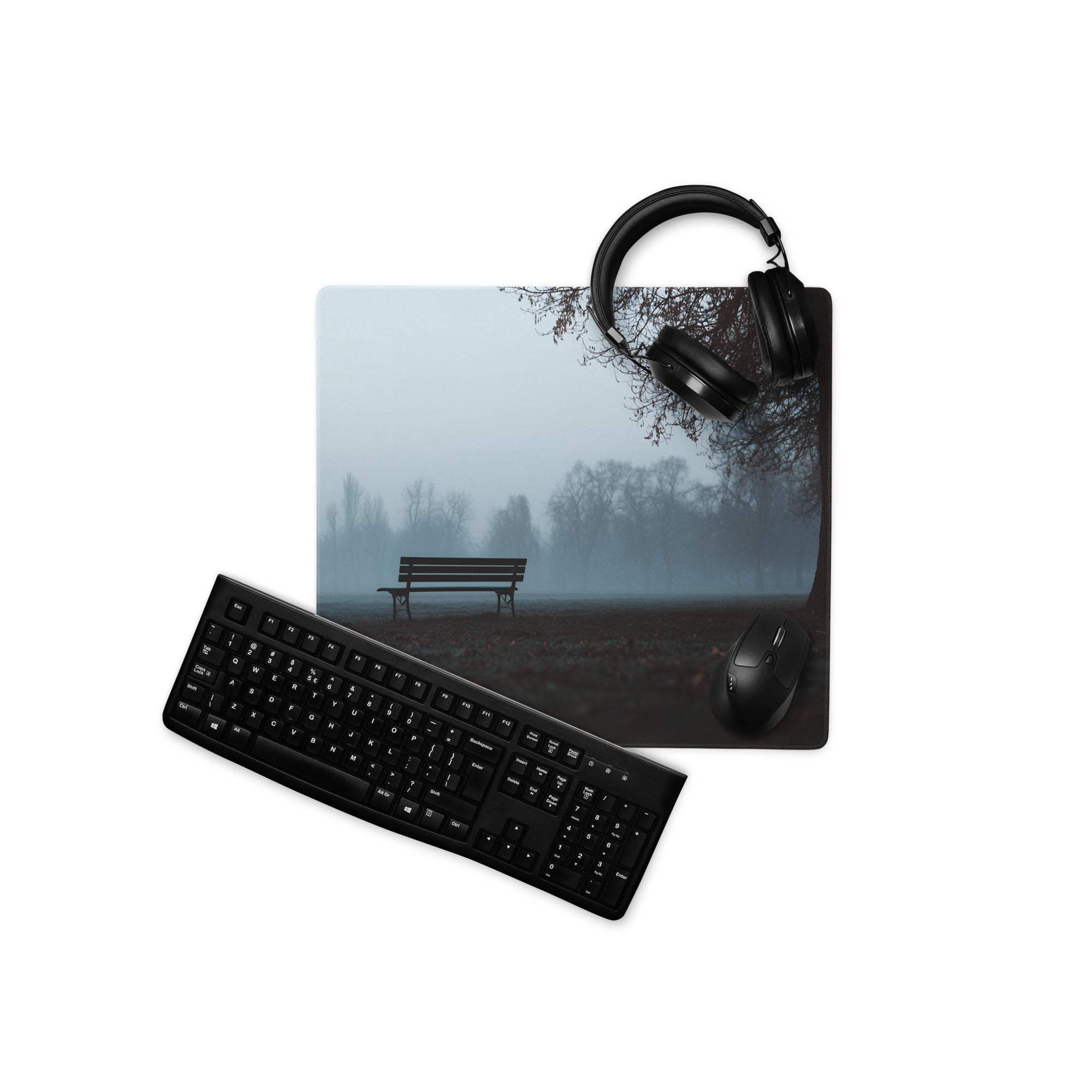 Large cinematic misty park bench gaming mouse pad with black keyboard, mouse, headphones