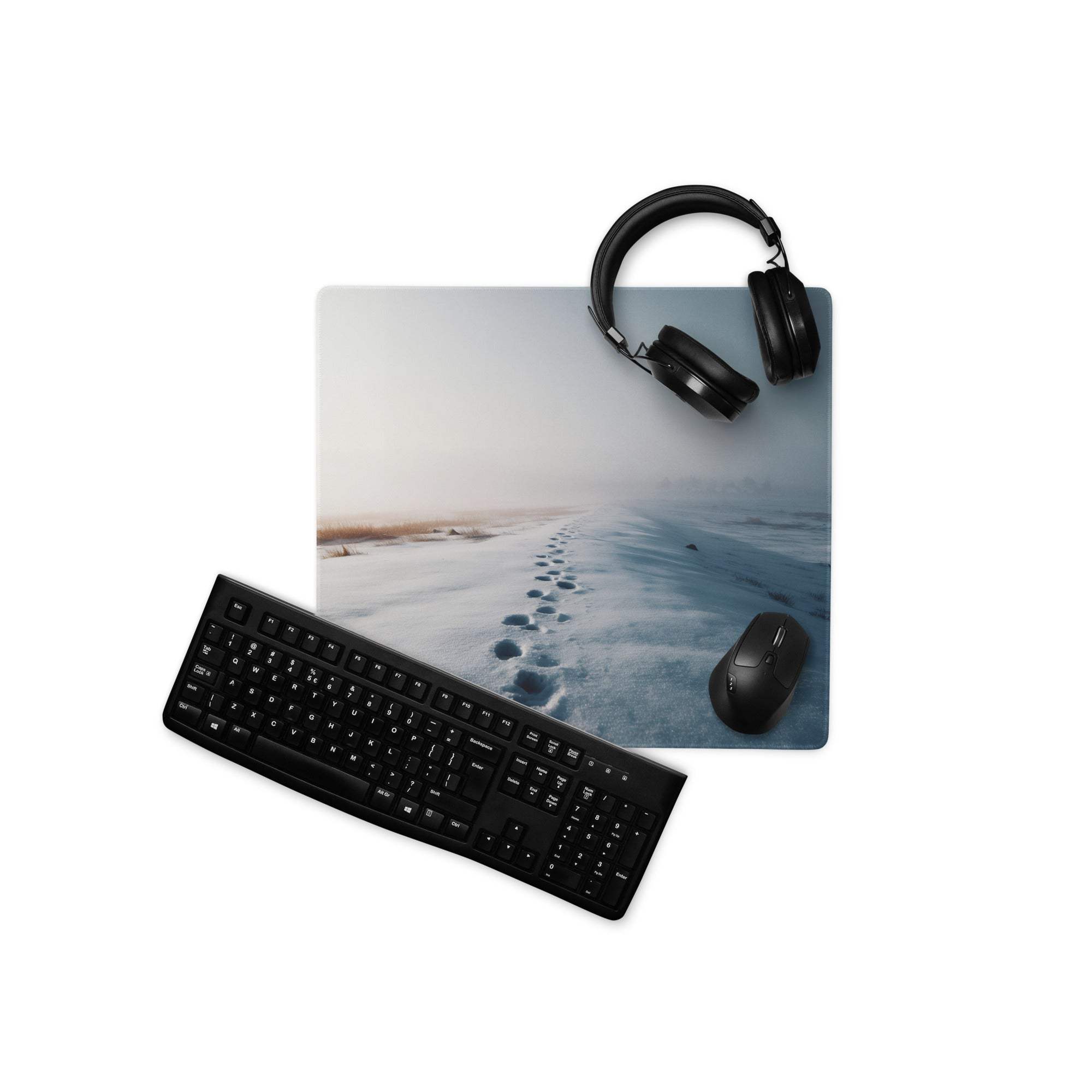 Black over-ear headphones on Calm Winter Blue Snowfield gaming mouse pad