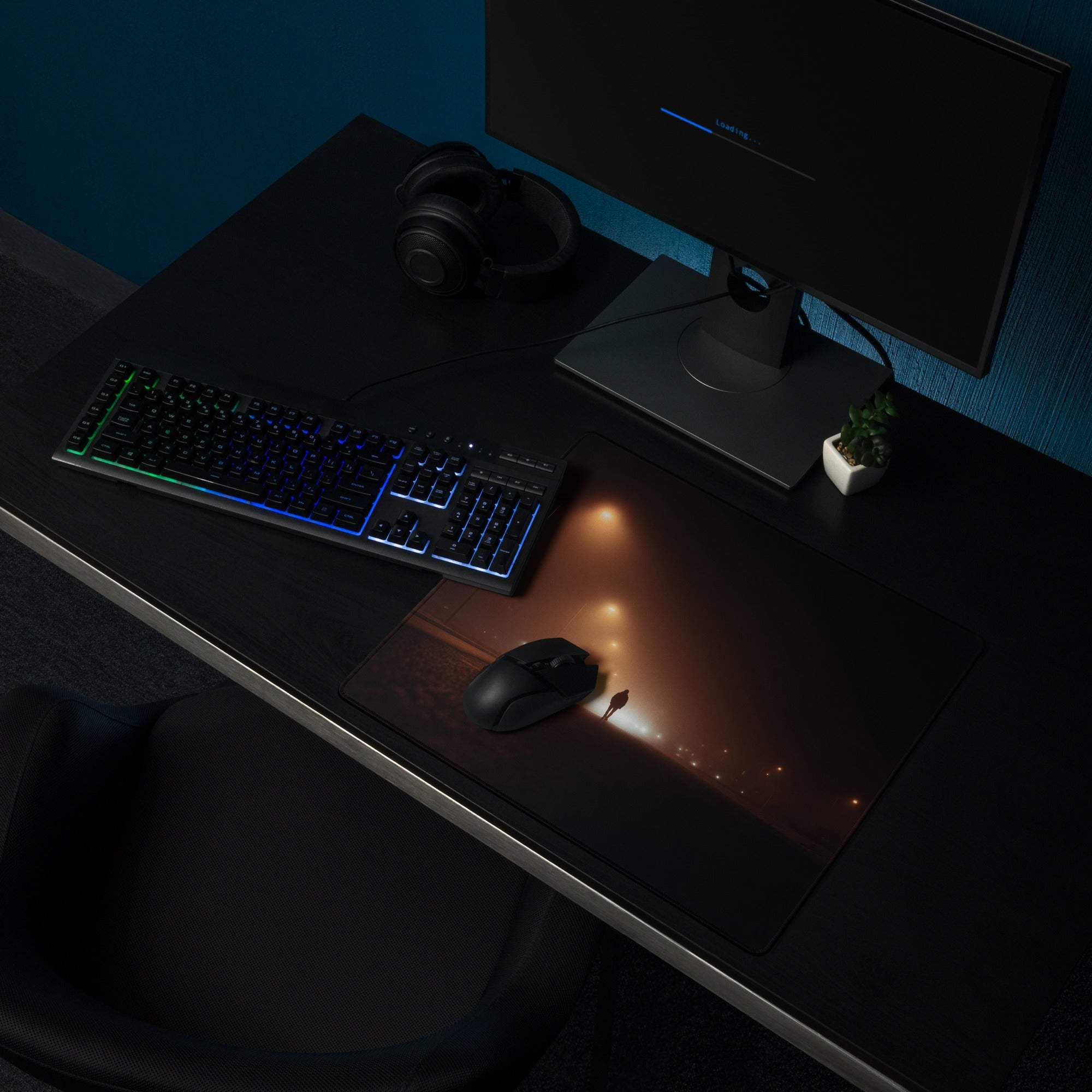 Black gaming mousepad with glowing cityscape and non-slip stitched base