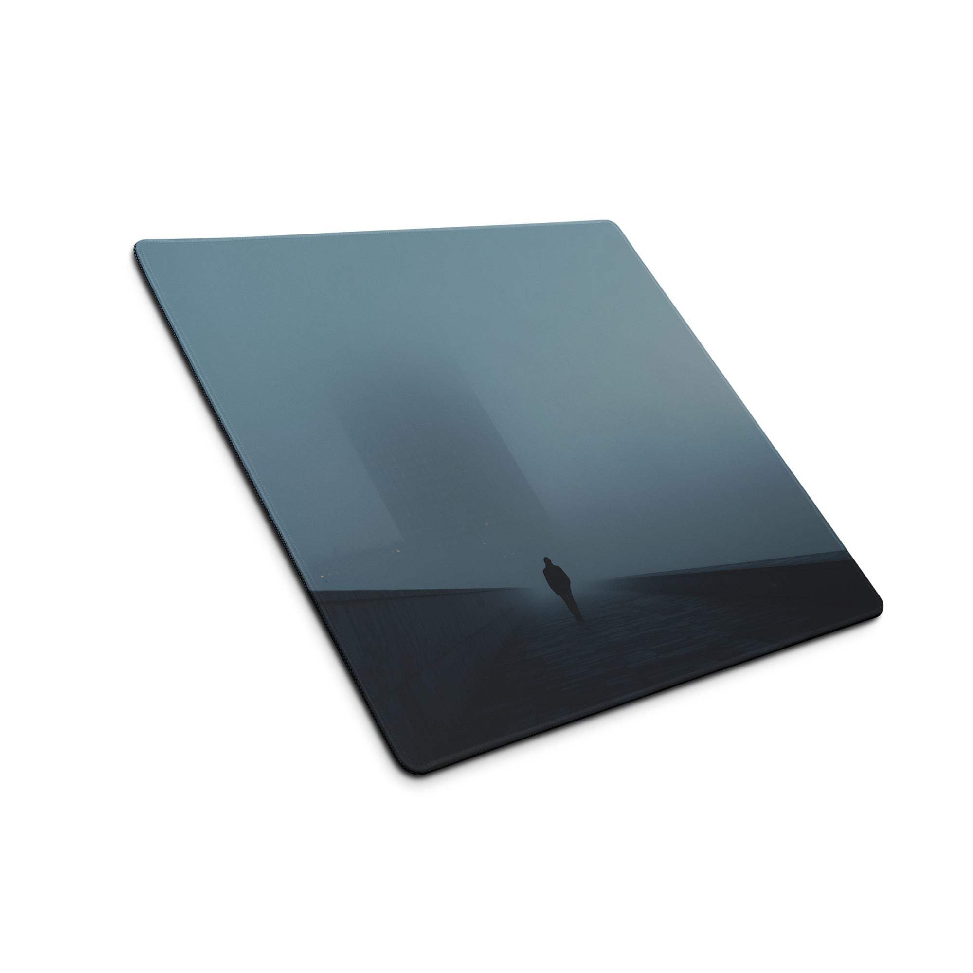 Moody Blue Mist gaming mouse pad with sleek glass-like square design, dark blue-black gradient, misty silhouette