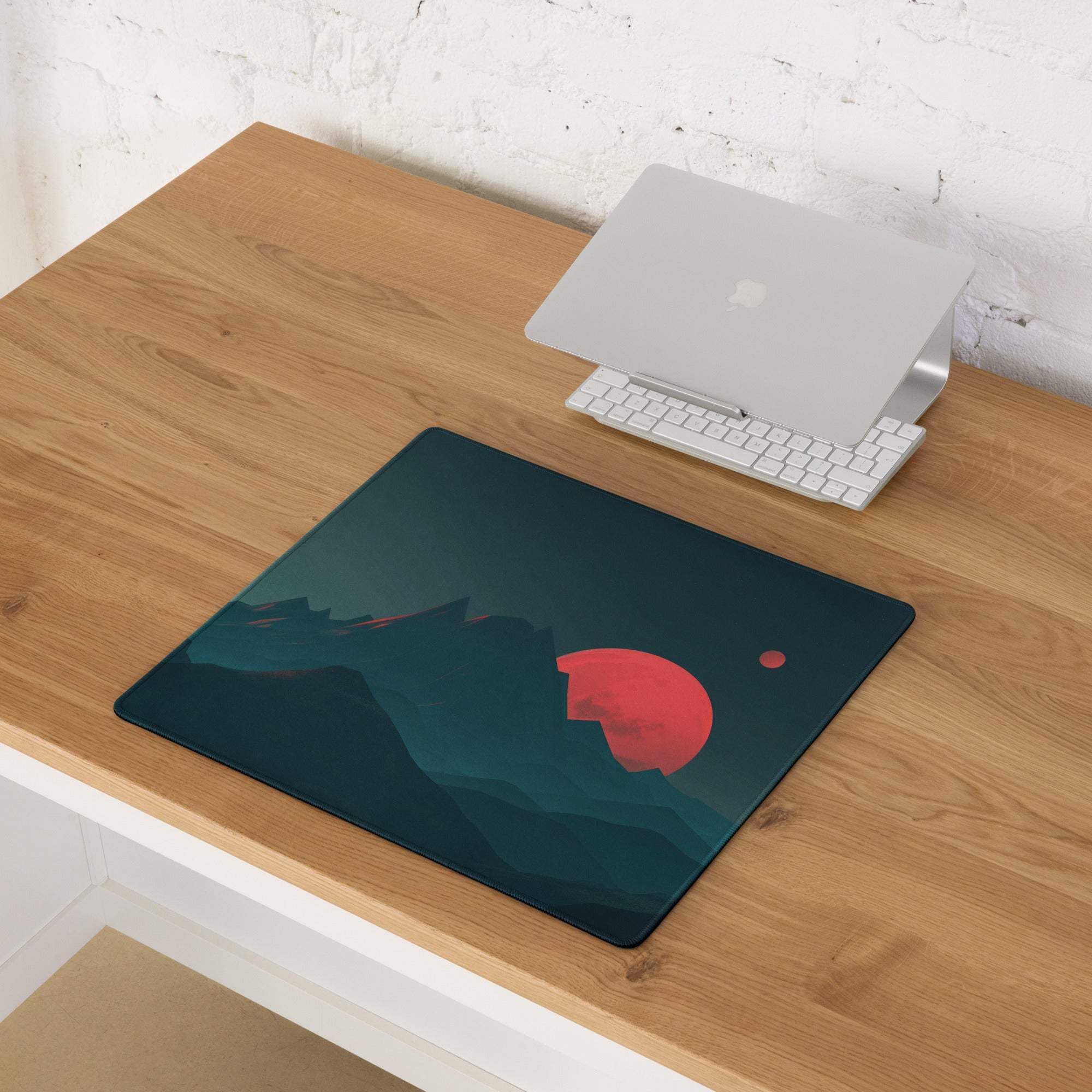 Dark teal gaming mousepad with red planet, moon, and mountain silhouettes