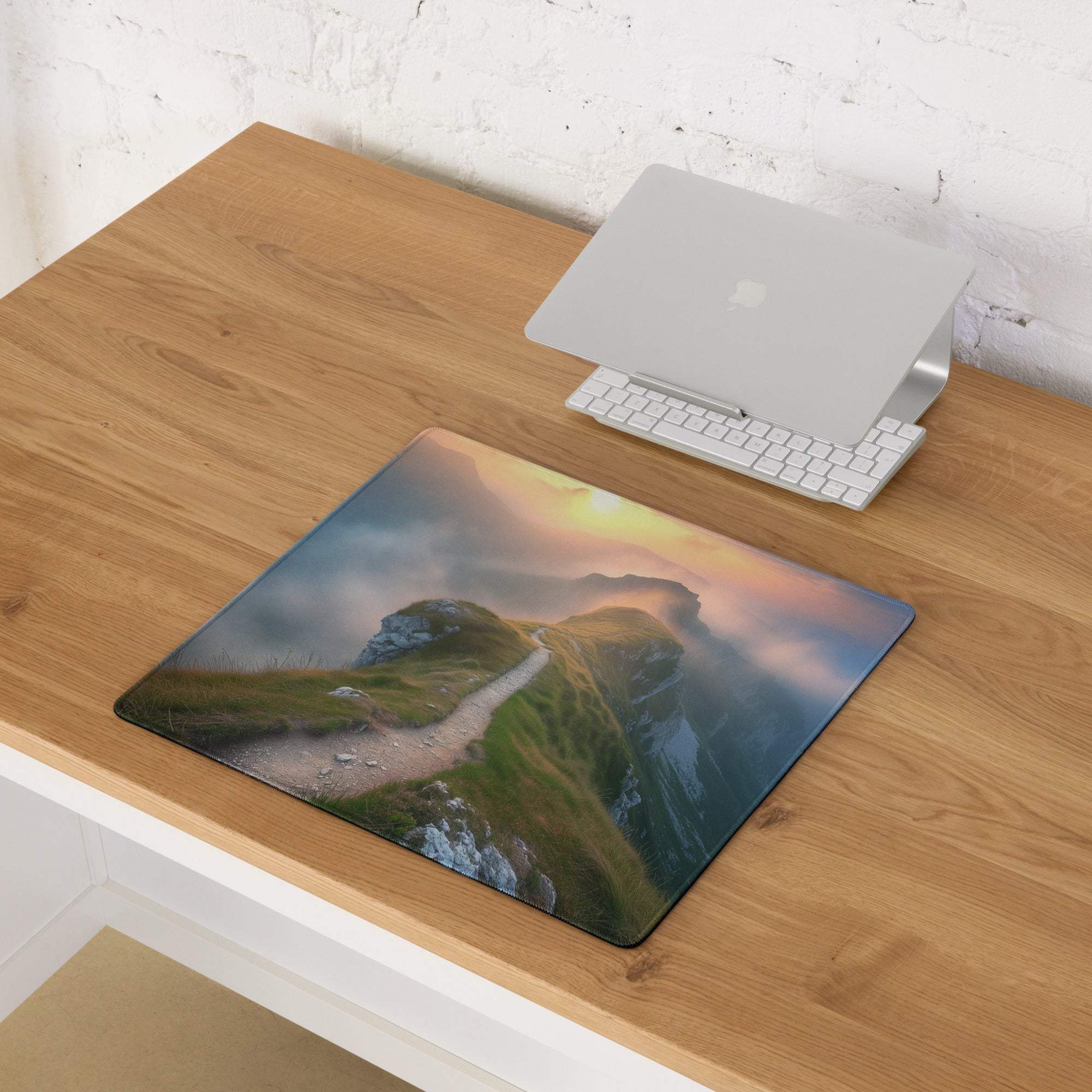 Vibrant sunrise mountain ridge gaming mouse pad with misty peaks and non-slip backing