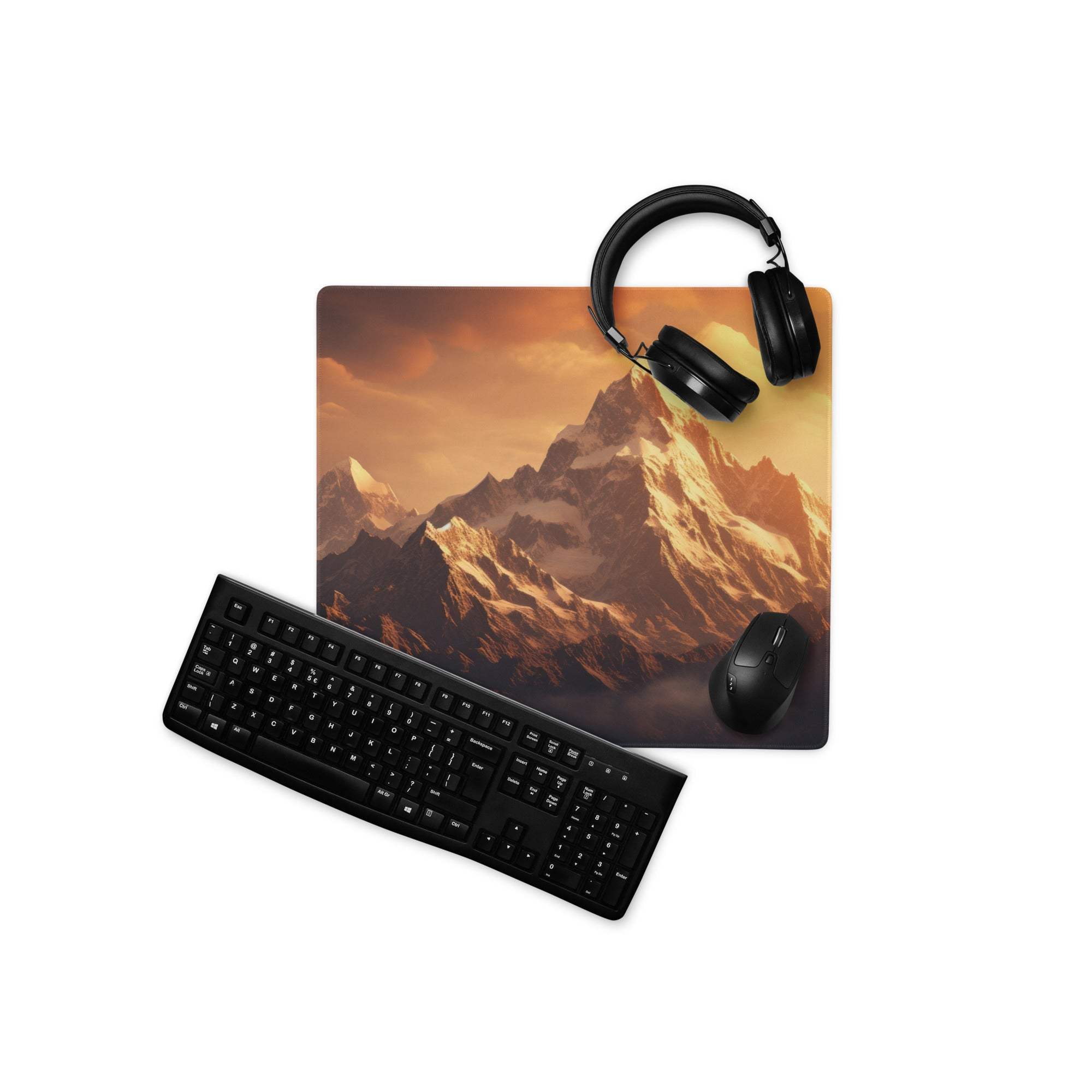 Black gaming headset on Epic Mountain Sunset mouse pad with orange sky