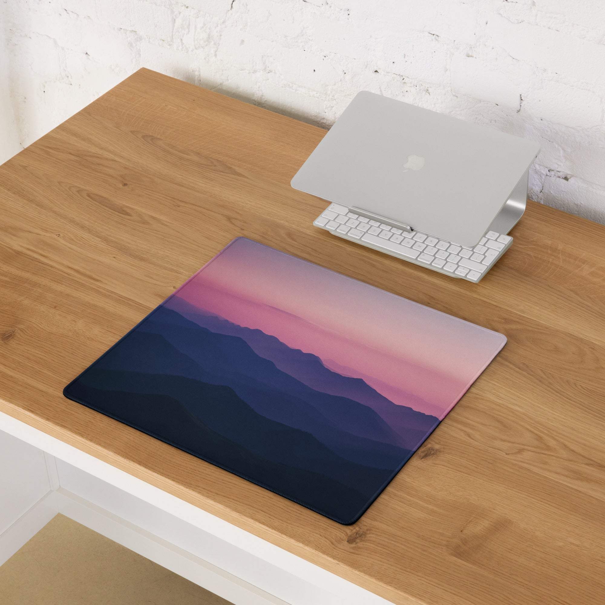 Twilight Mountain Range gaming mouse pad with navy-to-pink gradient mountains