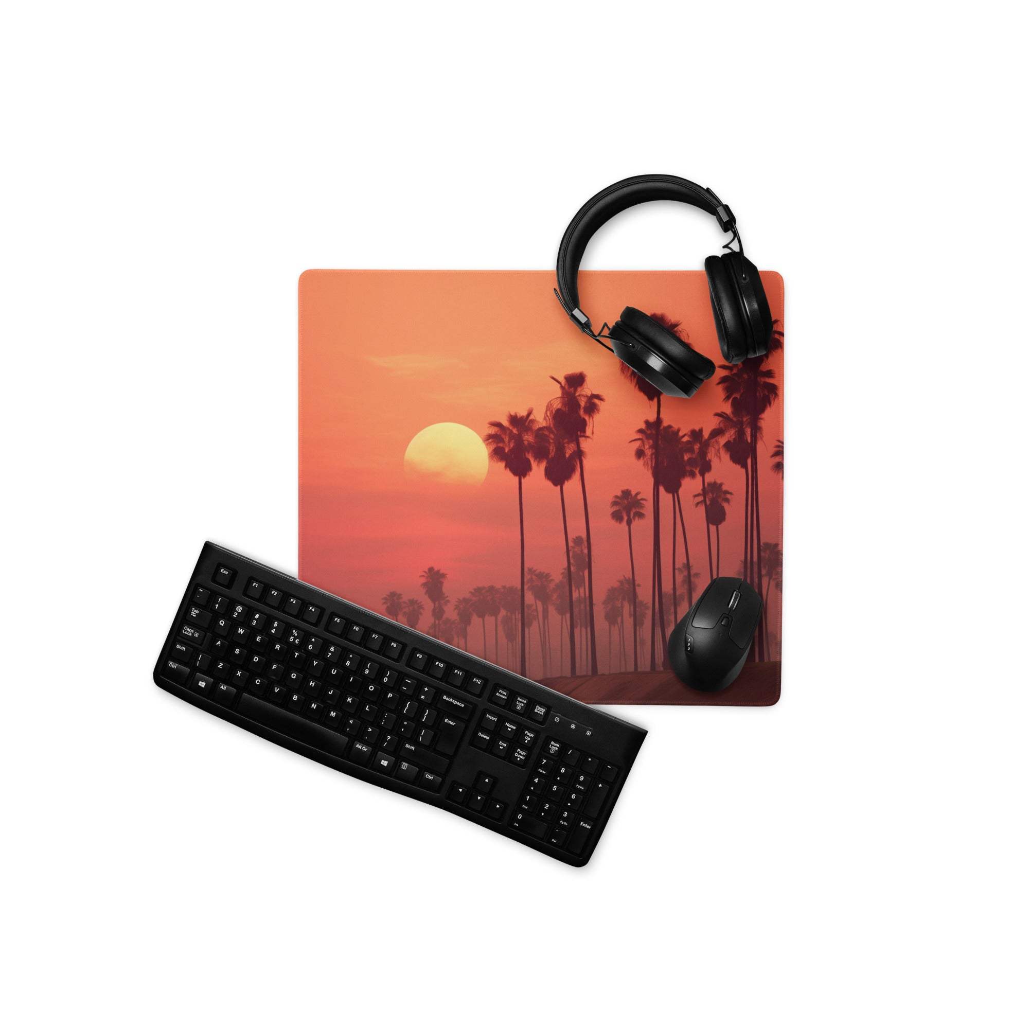 Vibrant orange sunset palm tree gaming mousepad with black keyboard and headphones