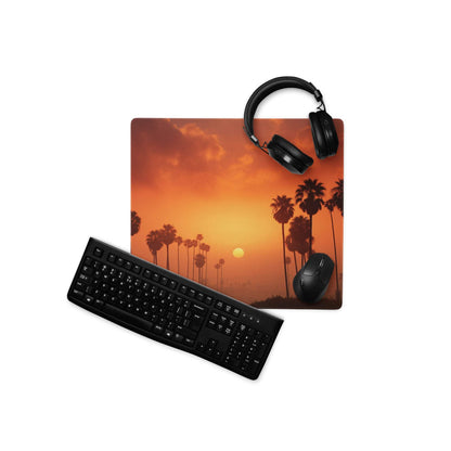 Orange palm tree sunset gaming mousepad with black keyboard and headphones