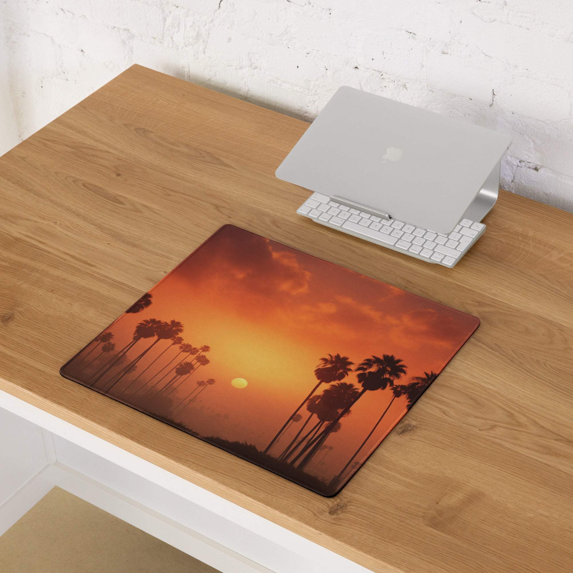 Vibrant sunset palm silhouettes on large gaming mouse pad with non-slip base