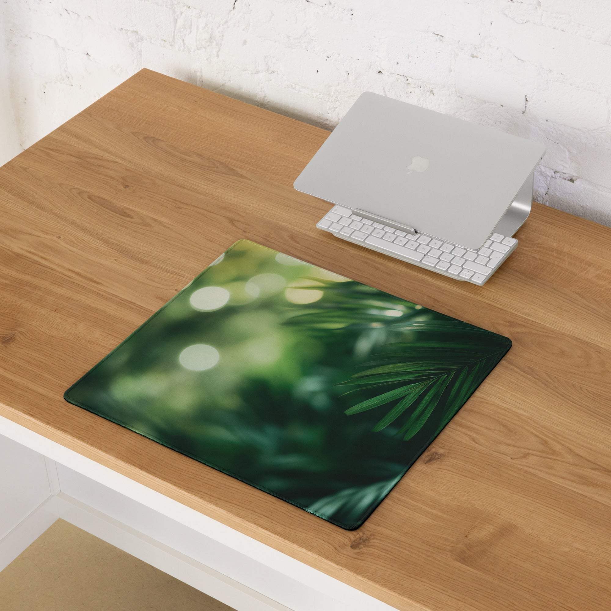Green palm leaf patterned large gaming mouse pad with non-slip backing