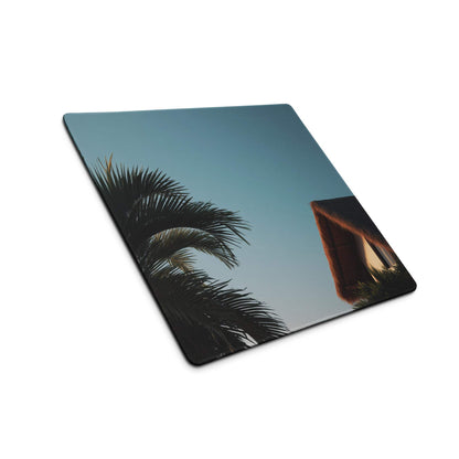 Large tropical palm sunset gaming mouse pad with non-slip base, palm fronds and thatched roof