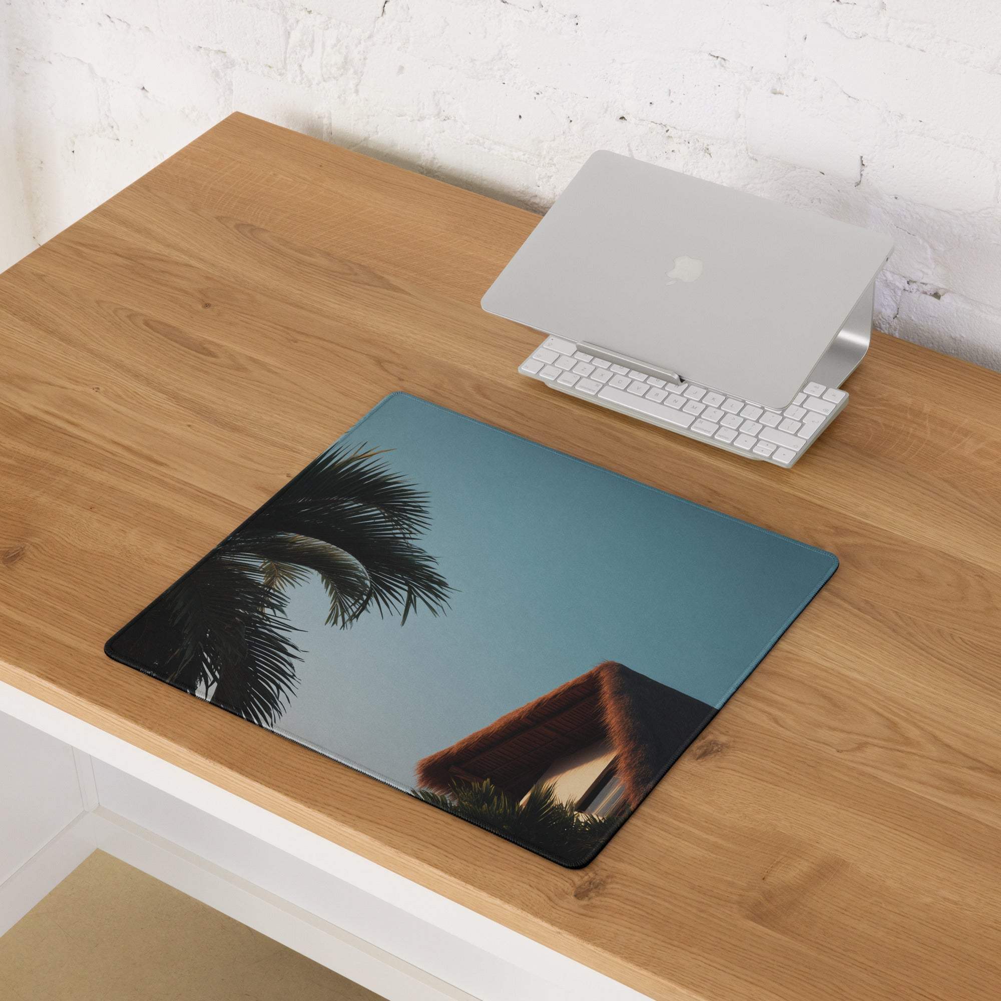 Large tropical palm sunset gaming mouse pad with non-slip base in teal, black, brown