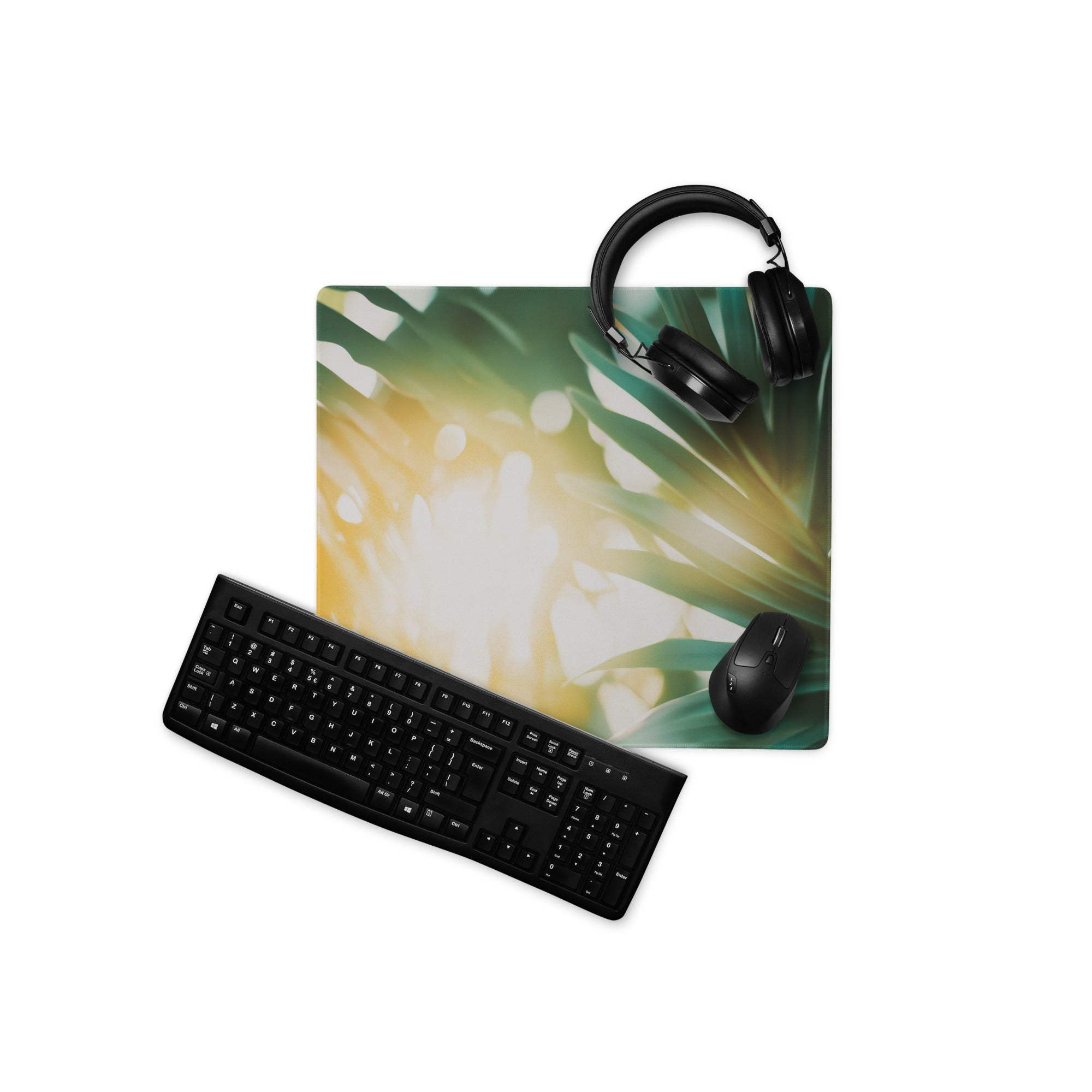 Tropical sunlit palm leaves gaming mousepad with keyboard, headphones, mouse