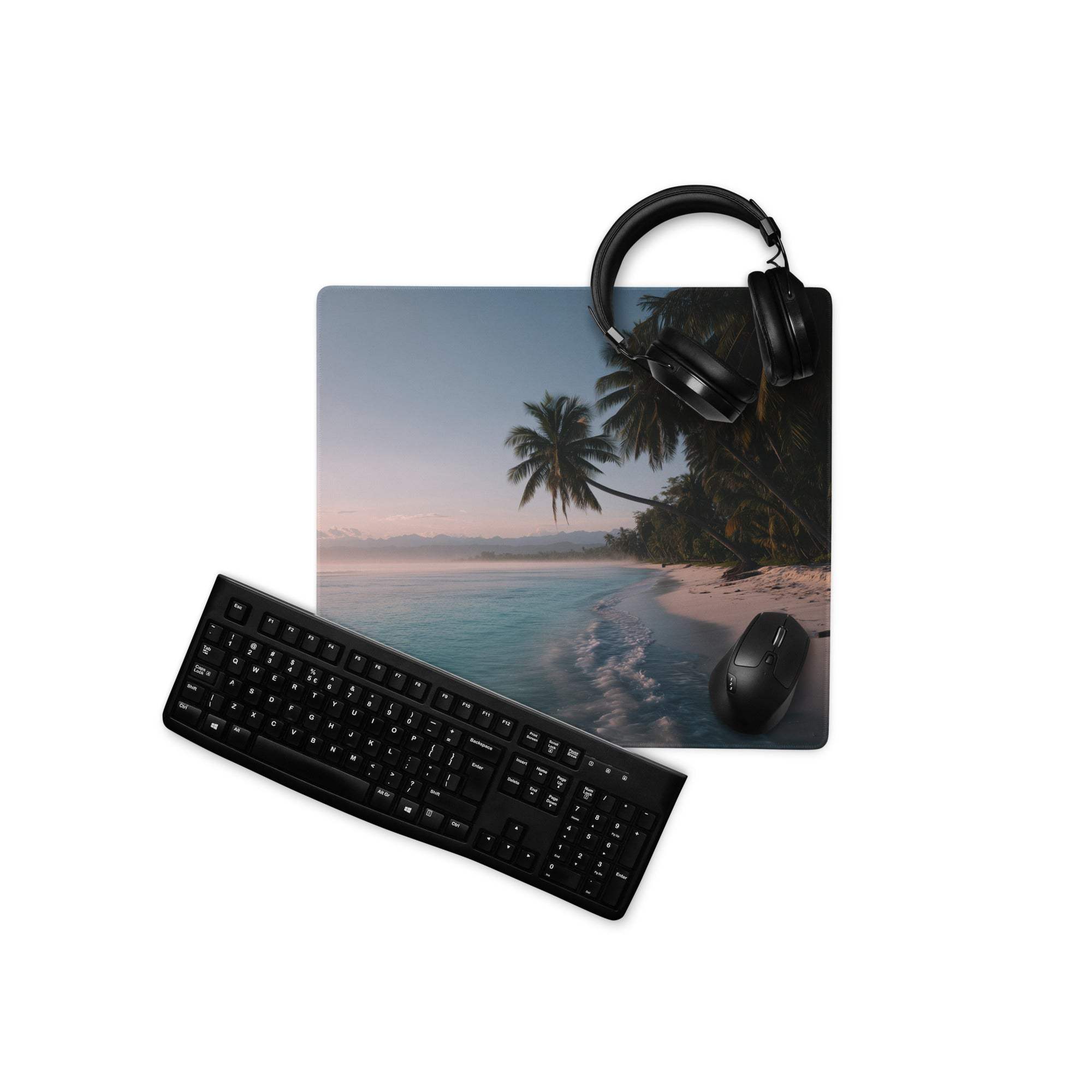 Black wireless mouse on tropical beach mousepad with headphones and keyboard