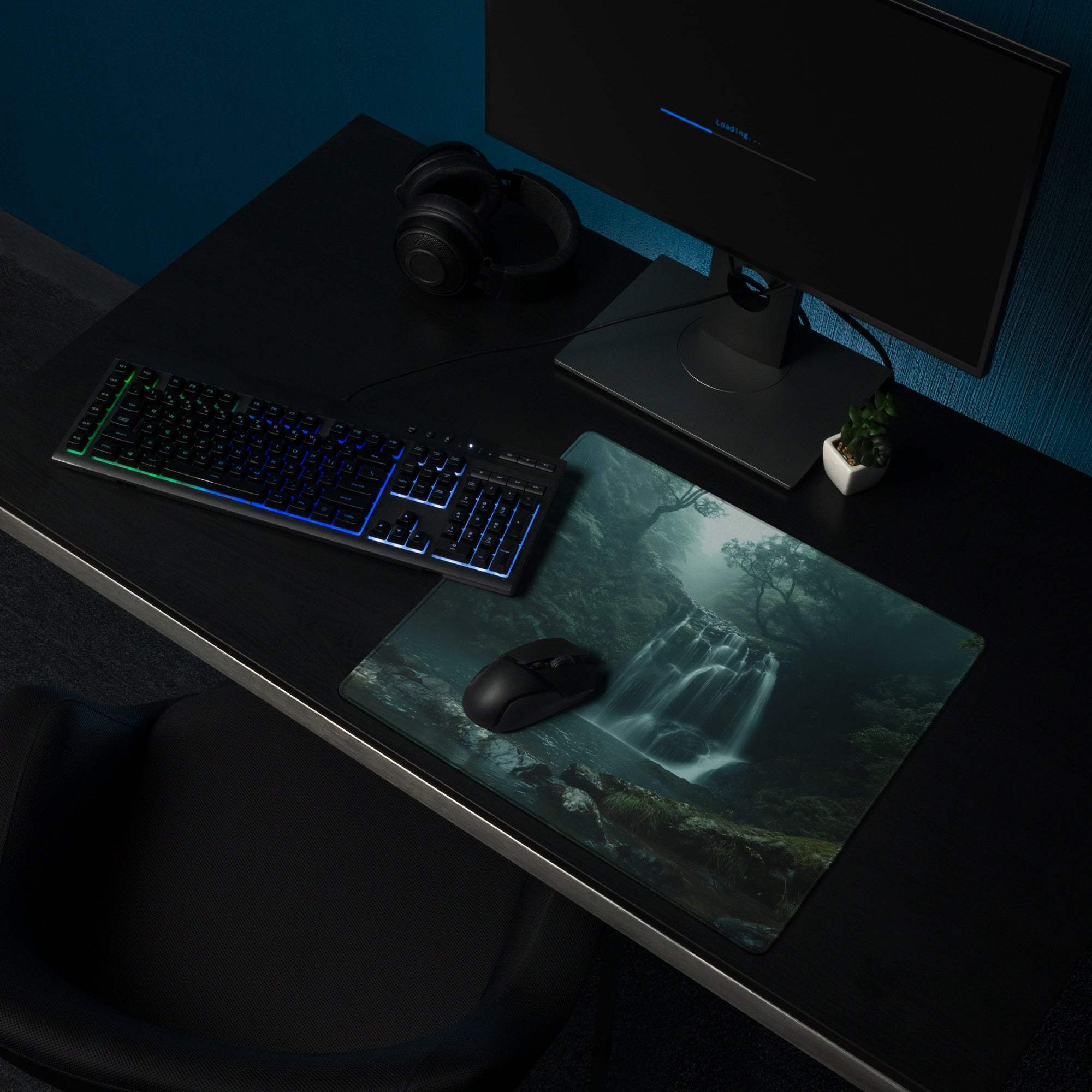 Moody Forest Green gaming mouse pad with teal waterfall, edge stitching, non-slip backing