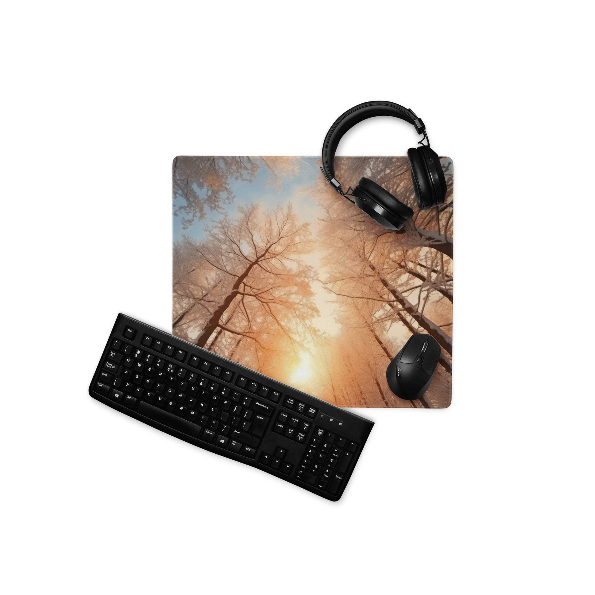 Black matte qwerty keyboard on Forest Dawn orange glow gaming mouse pad